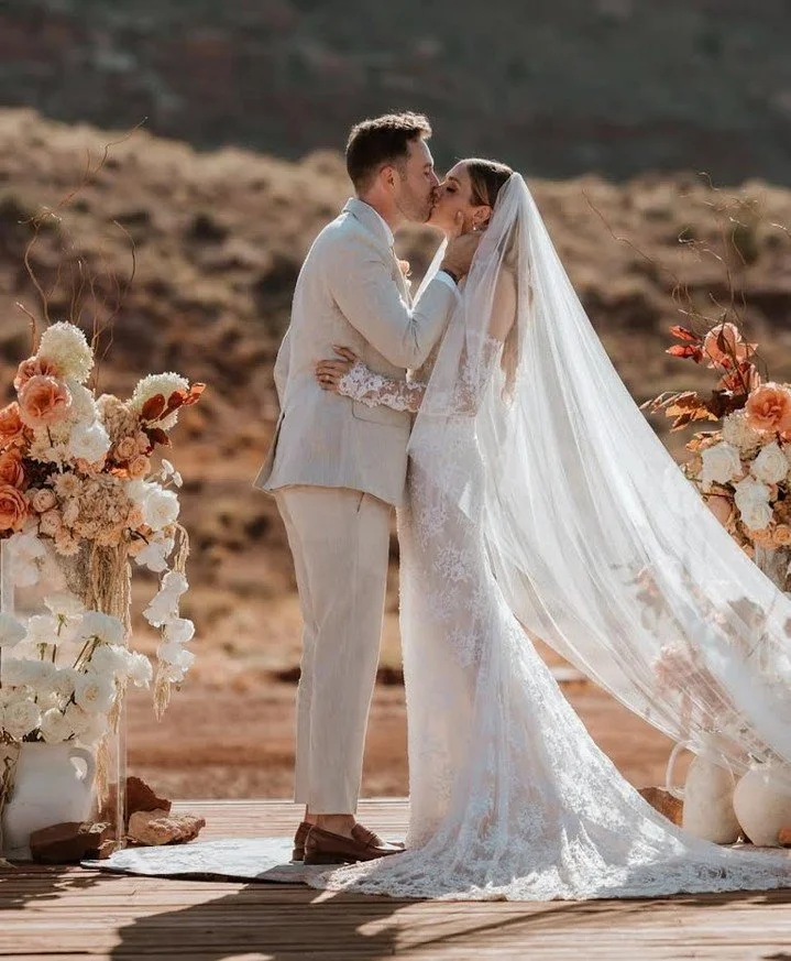Love in full bloom 🌸 Surrounded by desert beauty, our bride glows in her Ines Di Santo gown &mdash; a moment as timeless as the lace she wears. 🤍 @inesdisanto

#wedding #weddinginspo #bridalinspo #bridal #bride #inesdisanto #floraldress  #atelier #