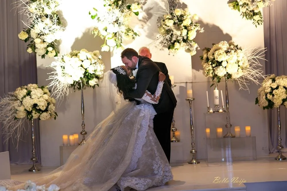 With a background of bustling bouquets, designer, Es&eacute; Az&eacute;nabor, has her first kiss while wearing the dress she designed for herself. 

#NYLBFW #WeddingInspiration #BridalFashion #WeddingDress #BridalInspo #WeddingStyle #RomanticWedding 