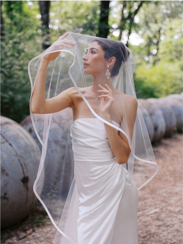 Indulgence veil by Toni Federici trimmed in a bold silk mikado finish, elevated to classic luxury.

#NYLBFW #WeddingInspiration #BridalFashion #WeddingDress #WeddingInspo #BridalInspo #WeddingStyle #RomanticWedding #WeddingPhotography #BridalStyle #D