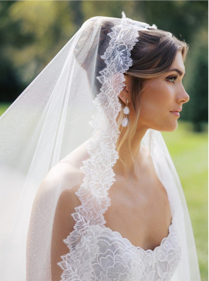 Traditional mantilla silhouette, Cara Mia, featuring a delicate chantilly lace border by Toni Federici.

#NYLBFW #WeddingInspiration #BridalFashion #WeddingDress #WeddingInspo #BridalInspo #WeddingStyle #RomanticWedding #WeddingPhotography #BridalSty