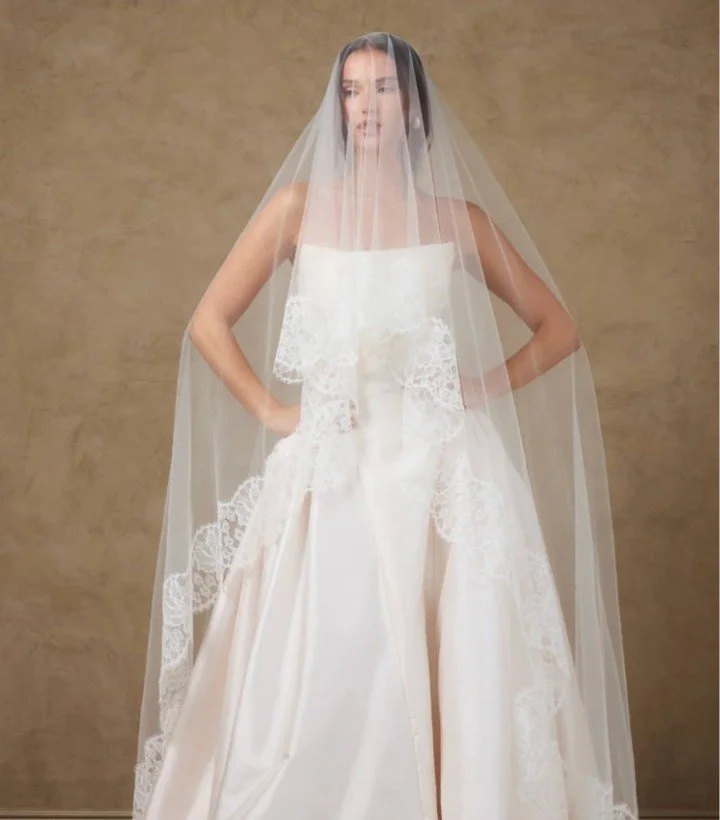 A soft white, tulle cathedral length veil, with delicate French Chantilly lace by Katherine Tash
#NYLBFW #WeddingInspiration #BridalFashion #WeddingDress #WeddingInspo #BridalInspo #WeddingStyle #RomanticWedding #WeddingPhotography #BridalStyle #Kath