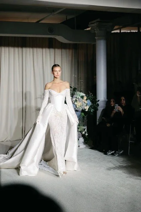 Sculpted satin, gothic sleeves, and lace that sharpens every silhouette.- @berta
 
#NYLBFW #WeddingInspiration #BridalFashion #WeddingDress #BridalInspo #WeddingStyle #RomanticWedding #WeddingPhotography #BridalStyle #DesignerGown