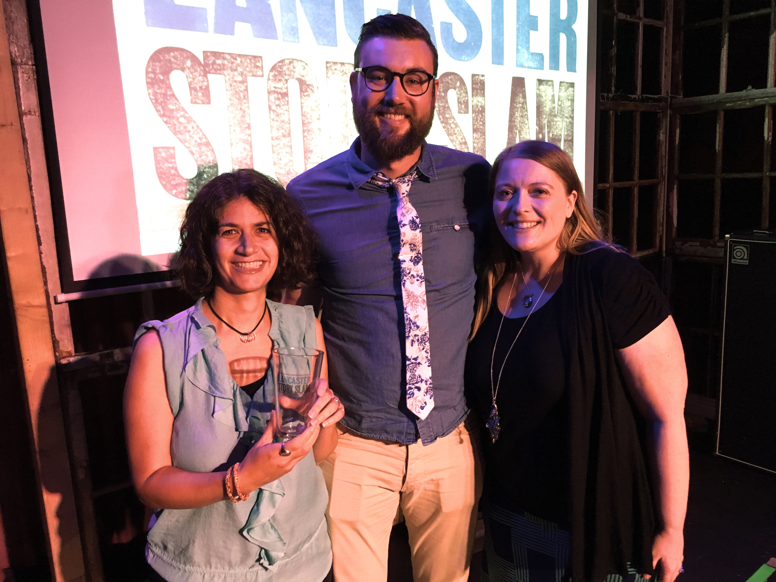 Jamie Beth and Bryan Caine pose with emcee Donna Talarico