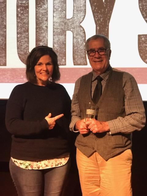 Emcee Luanne Sims congratulates winner Tony Crocamo for his perfect score and winning the prized pint glass!