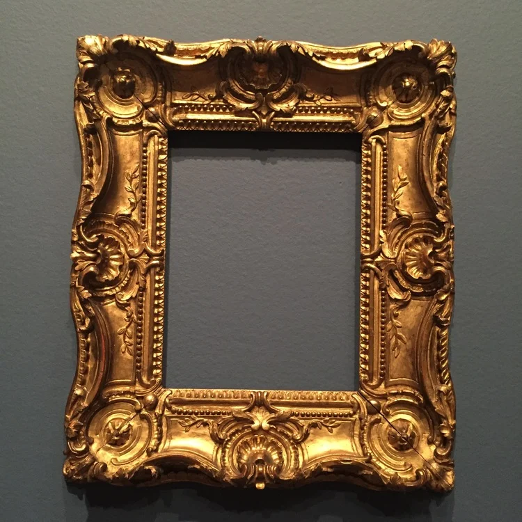 Swept sides and pierced carving are typical of Louis XV frames.