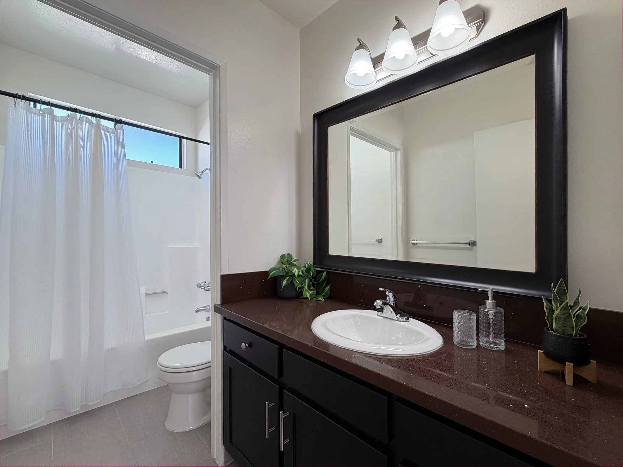   Elegantly renovated master bathroom with refined finishes  