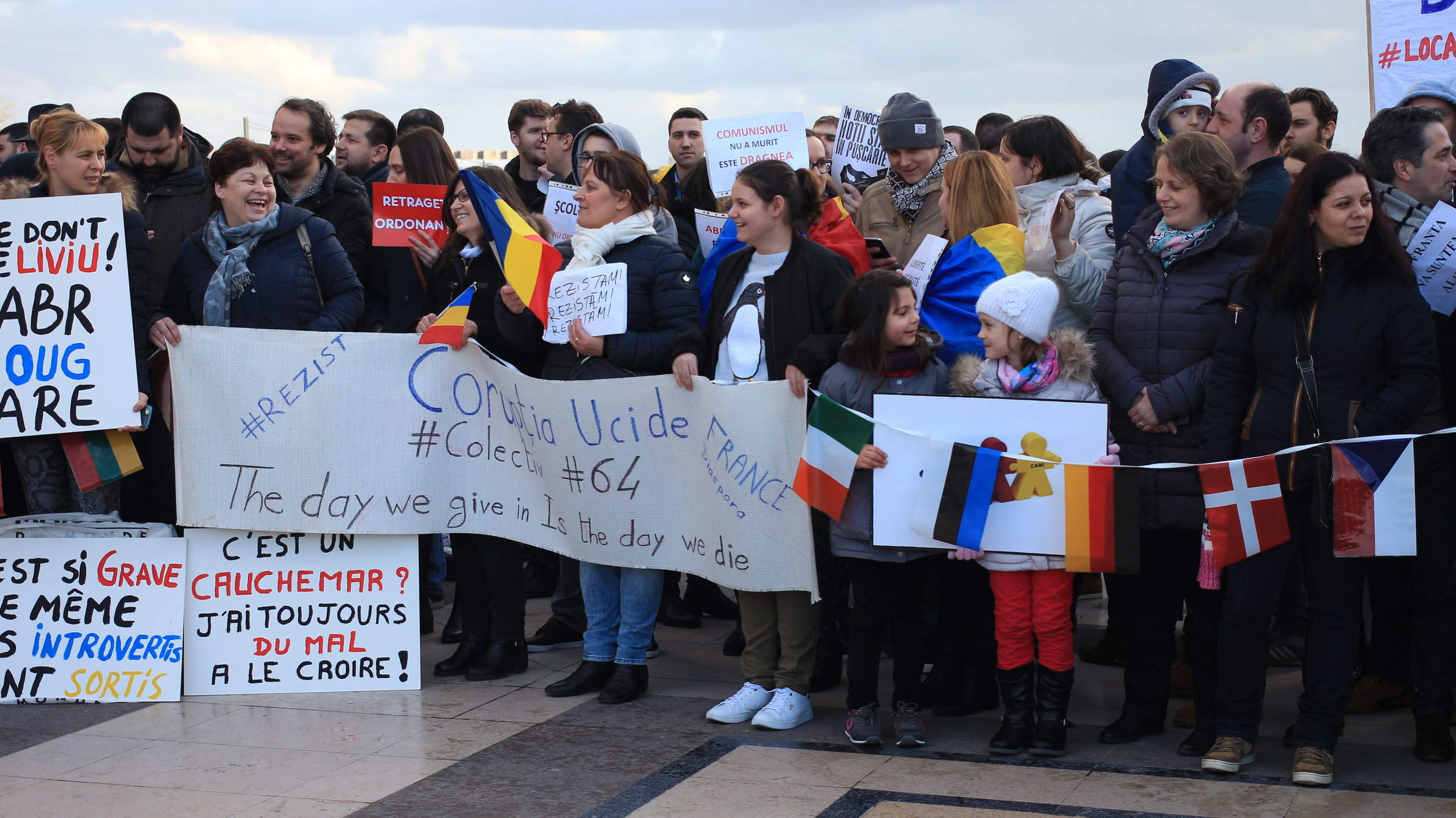 Photo from the solidarity protest in Paris. The banner reads 'Corruption kills'. #Colectiv making a reference to the incident in the club and previous protests. The line ' the day we give in is the day we die' is part of the lyrics from Goodbye to Gravity , the band that was playing the night of the club fire. 4 of its 5 band members died in the fire. It has become a leitmotif for the #Colectiv protests and it has been reused in the recent wave of protests.