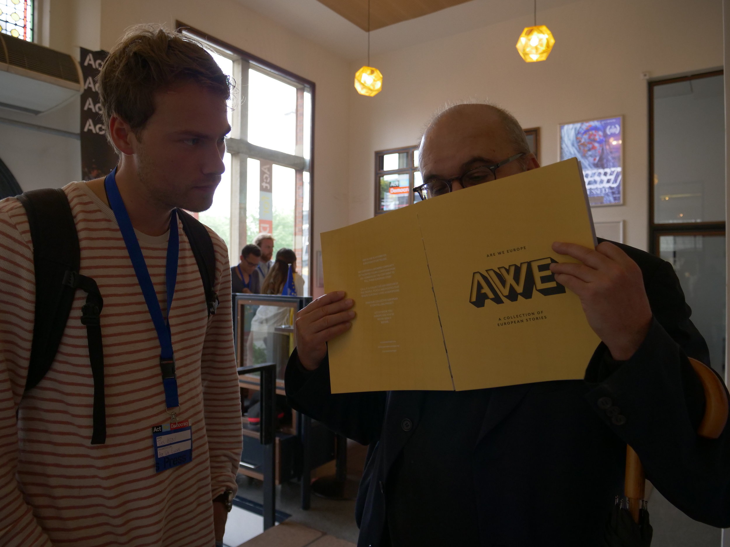 Economist Branko Milanovic takes a whiff of our Collection of European Stories before going up on the stage.