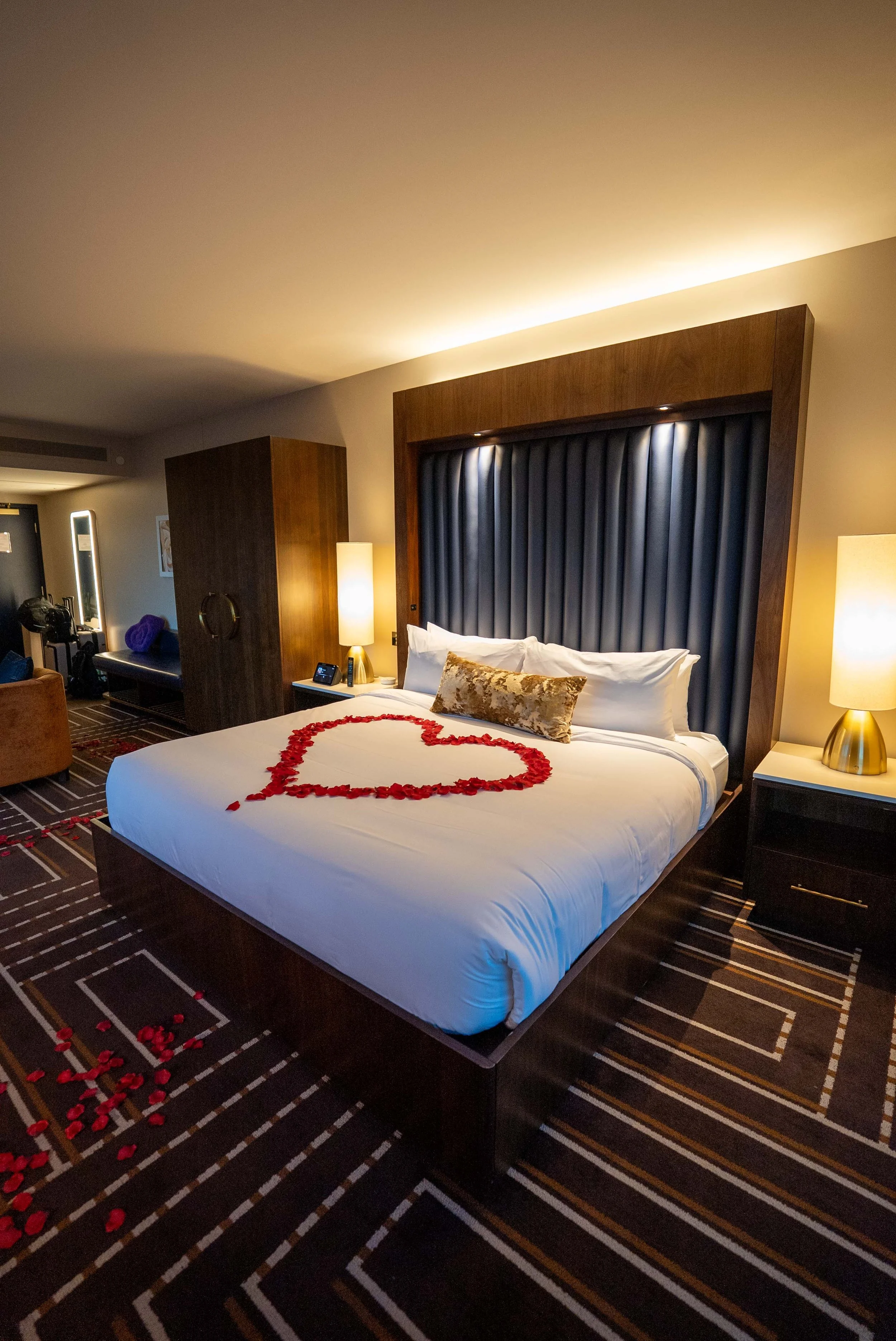 Hotel bed with roses shaped in heart