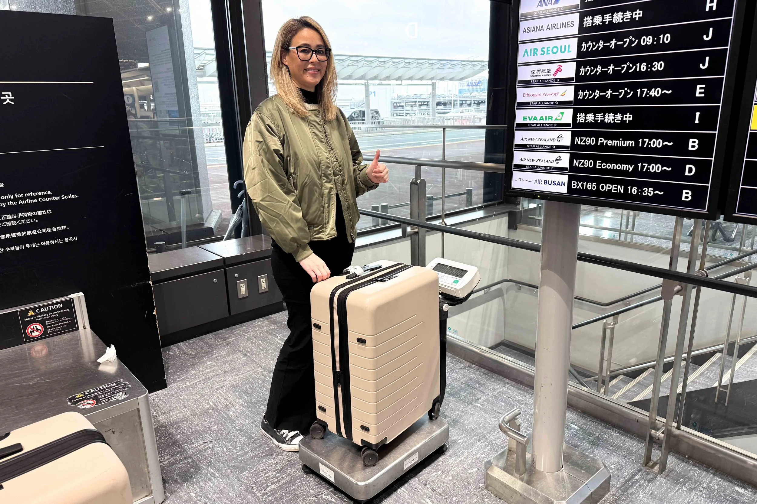 Weighing suitcase at airport