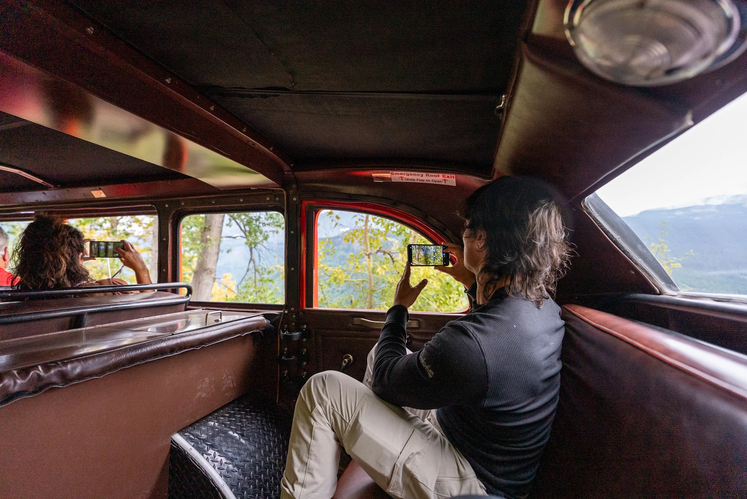 Taking pictures in the back seat