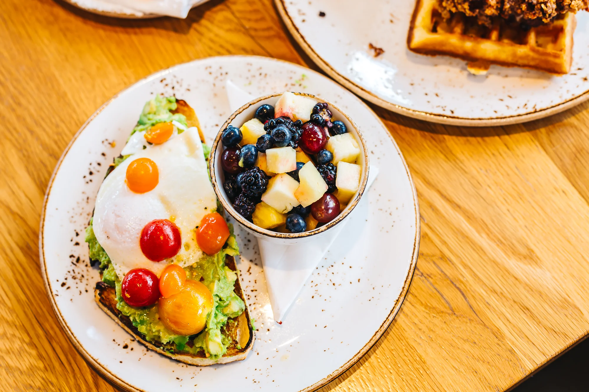 Pressroom's colorful avocado and toast with fresh fruits