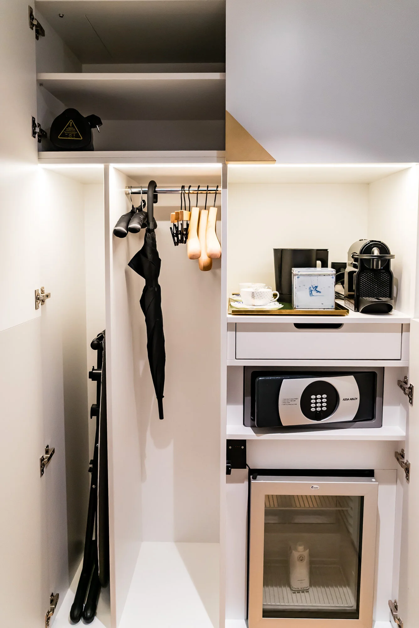 Closet with iron, umbrella, safe, refrigerator