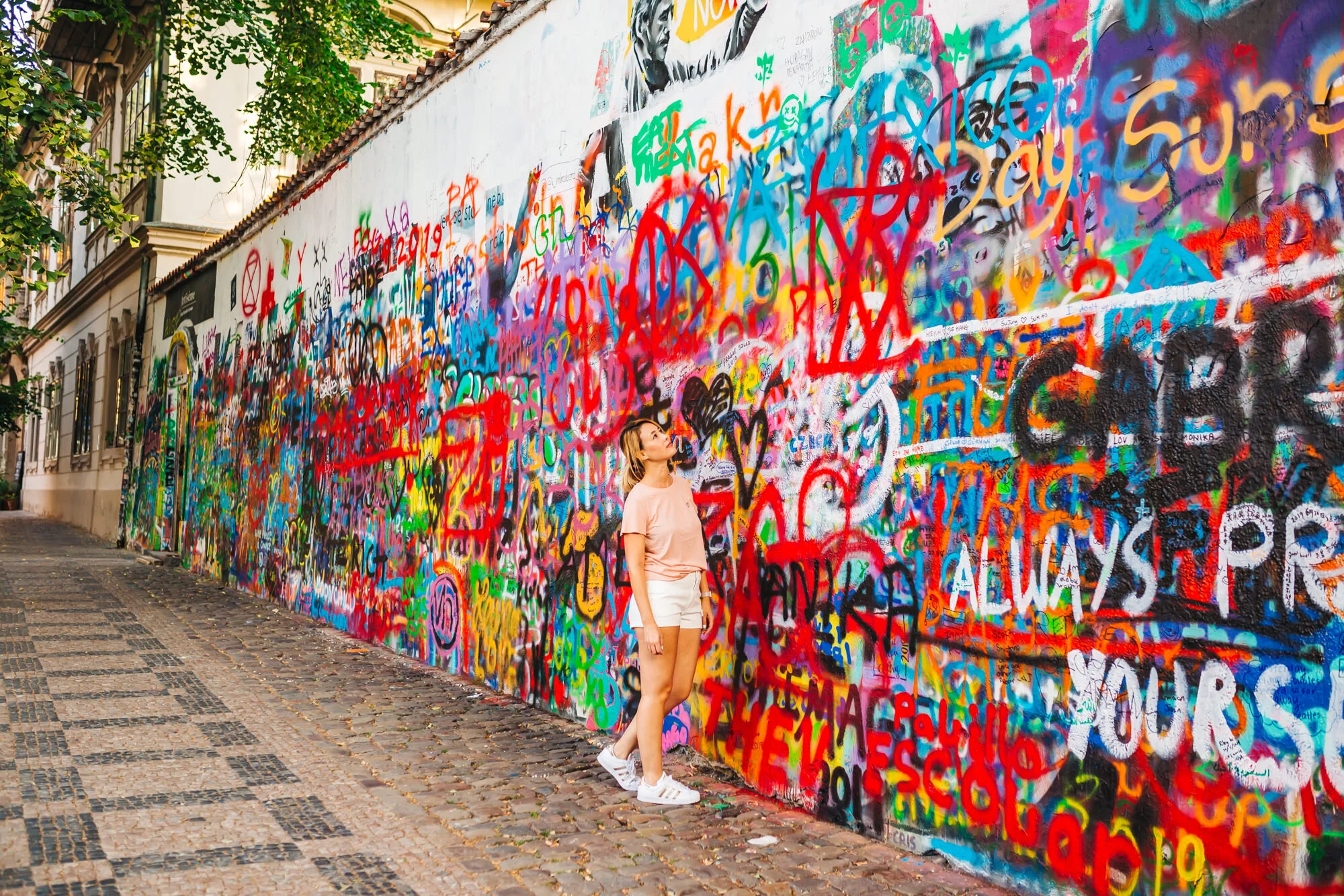 Layers and layers of paint on the John Lennon Wall