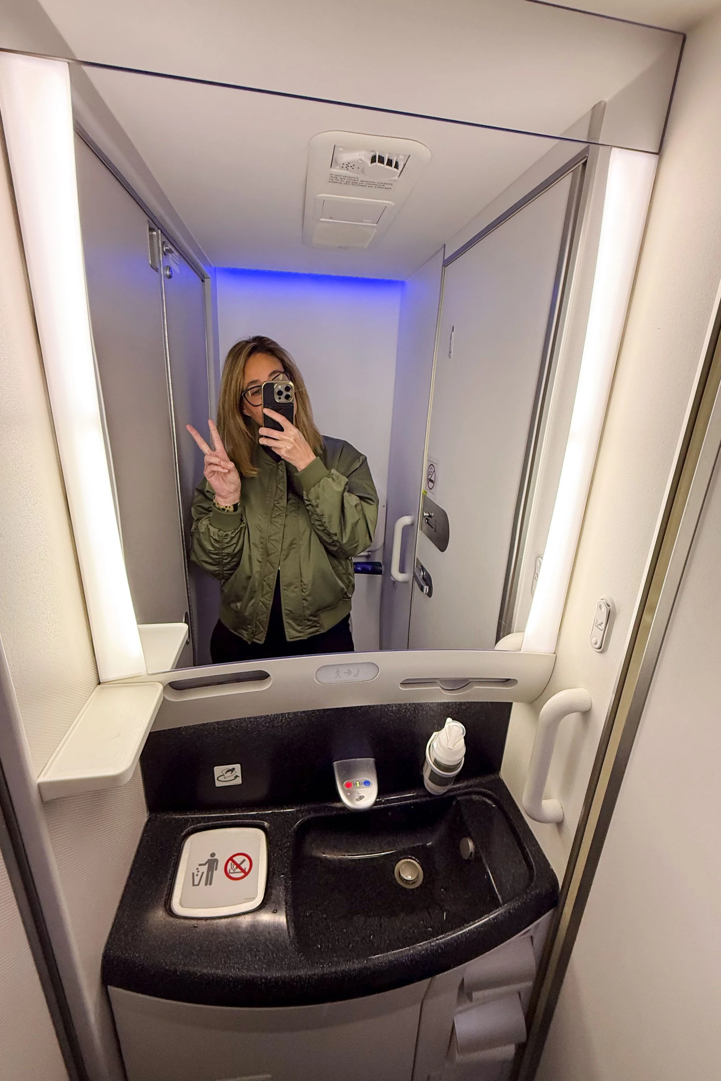 Taking a selfie in the aircraft bathroom