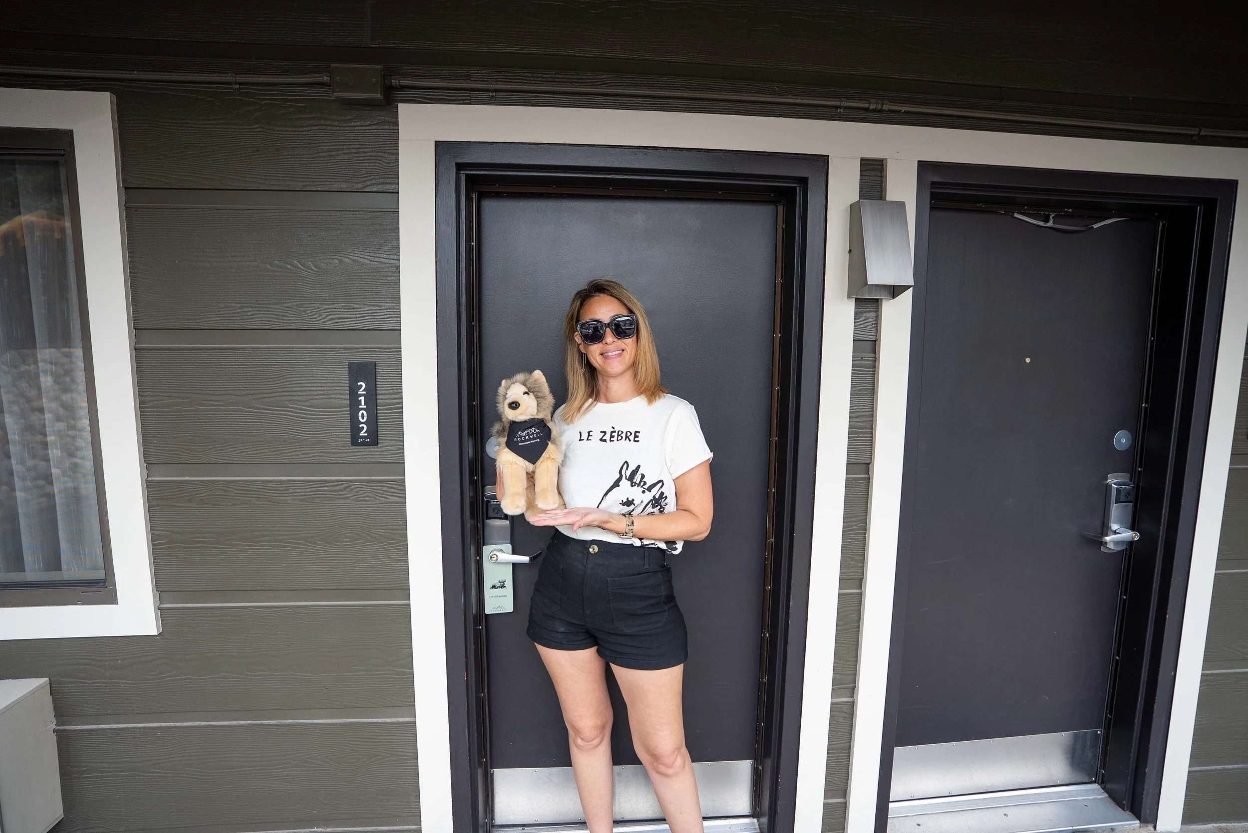 Holding Roxie the wolf stuffed animal