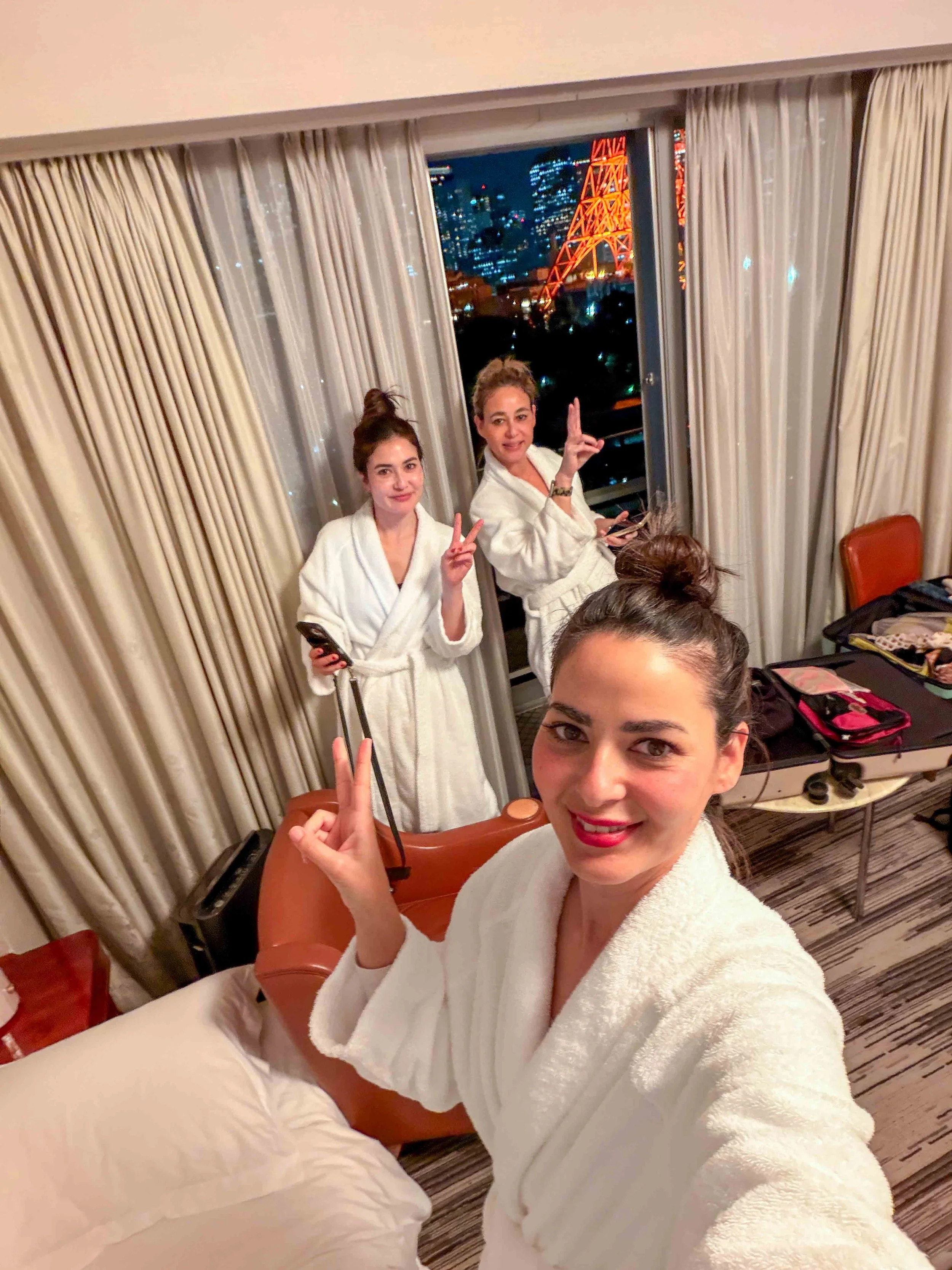 Three women in a hotel room