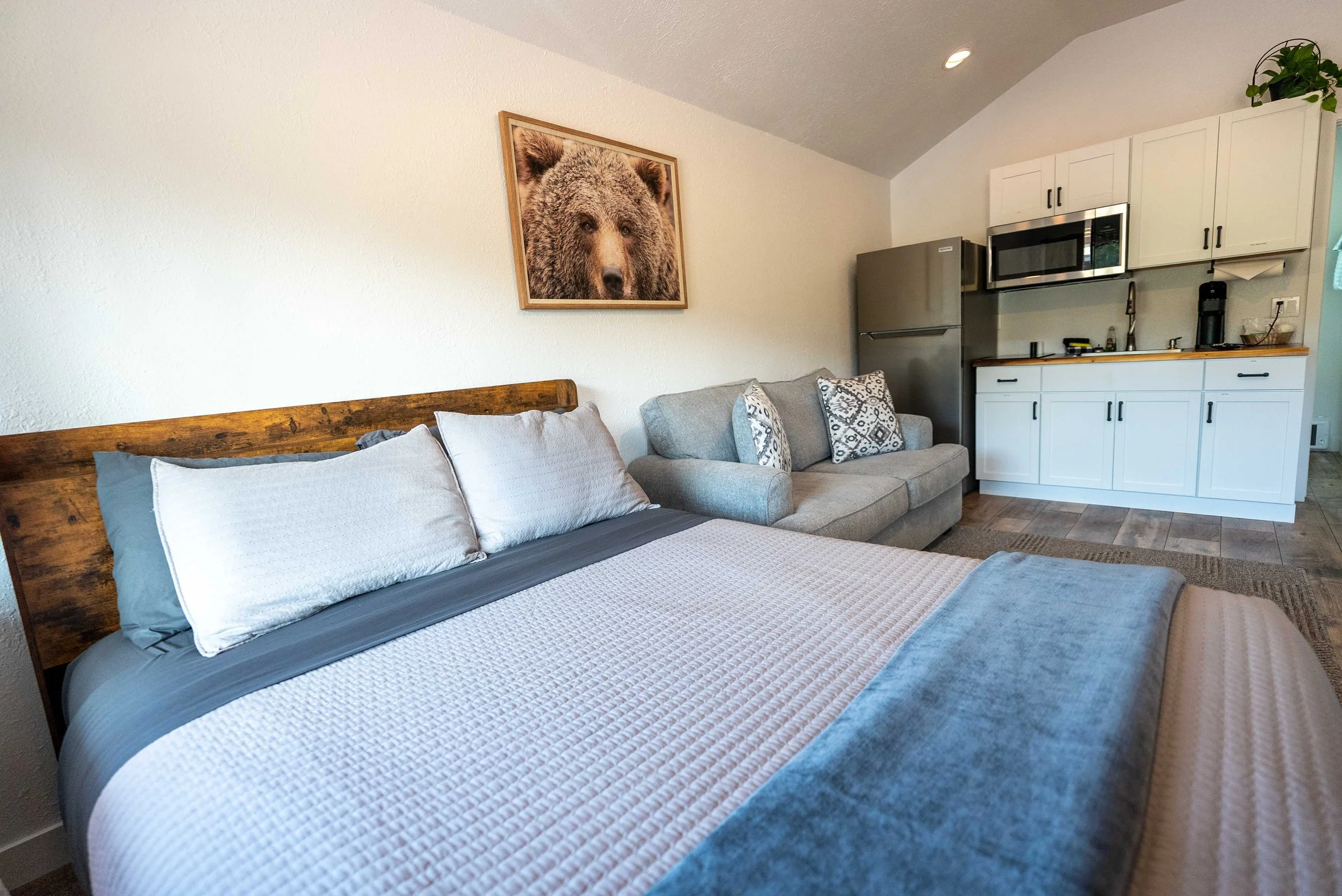 Cozy queen bed room inside the Sky Eco cabin