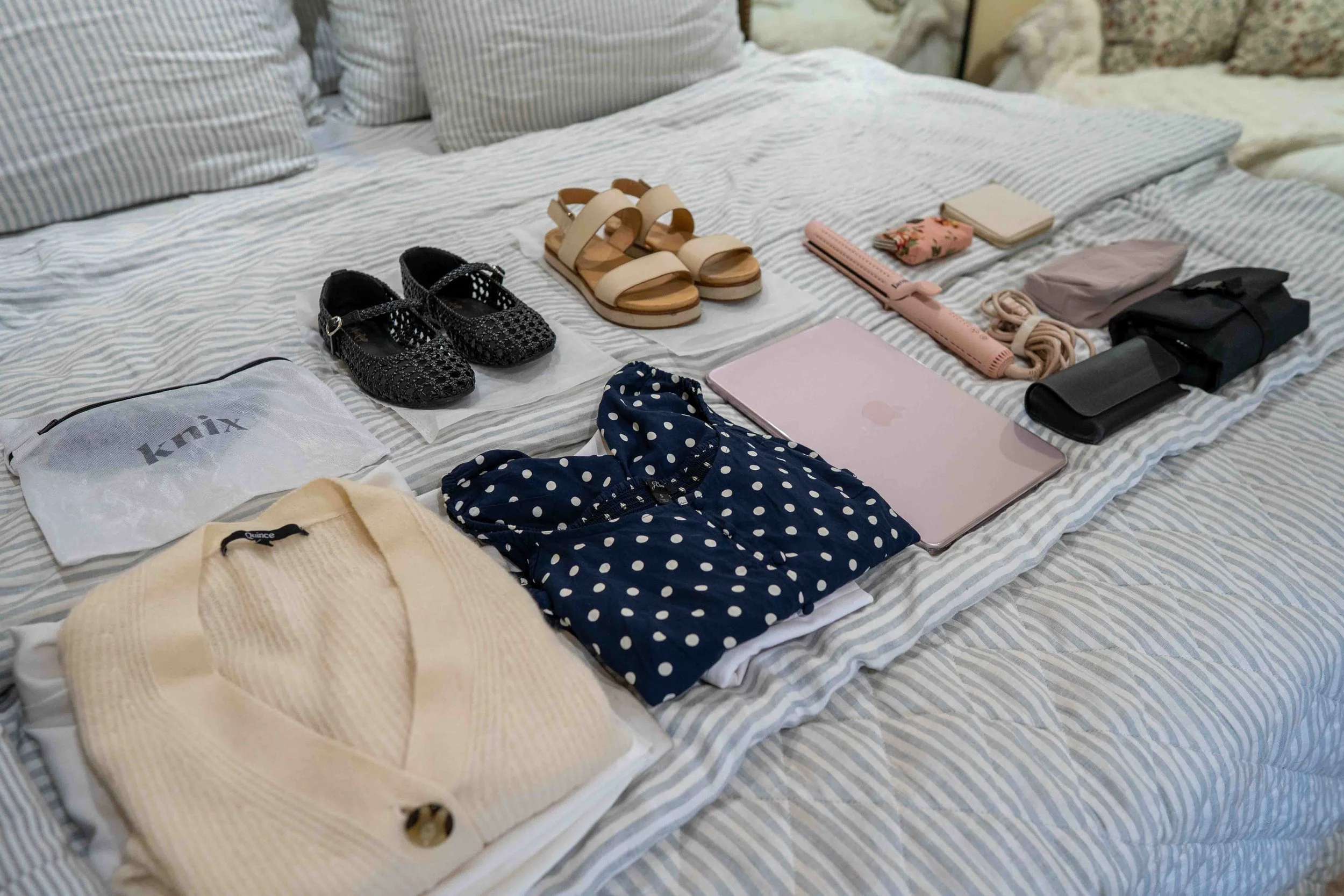 Clothes on the bed for packing