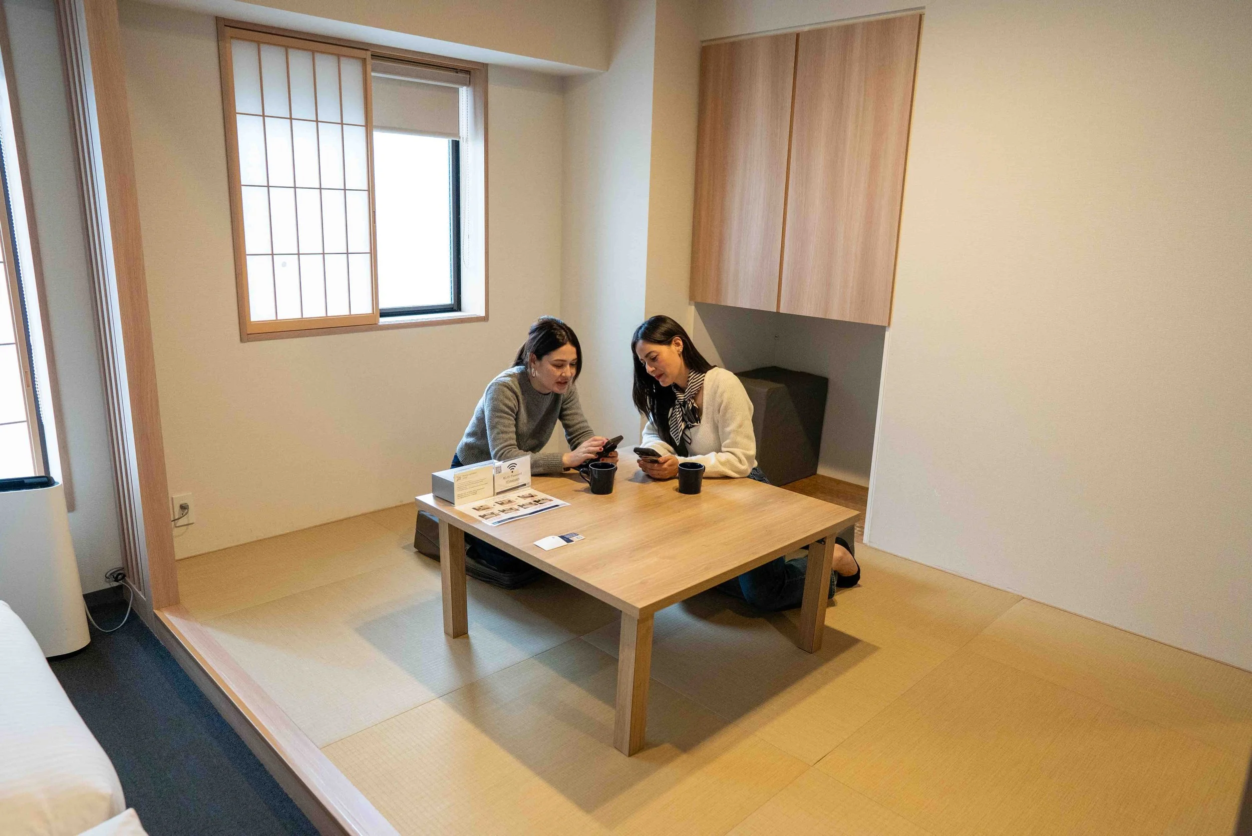 two woman sitting in a tatami room