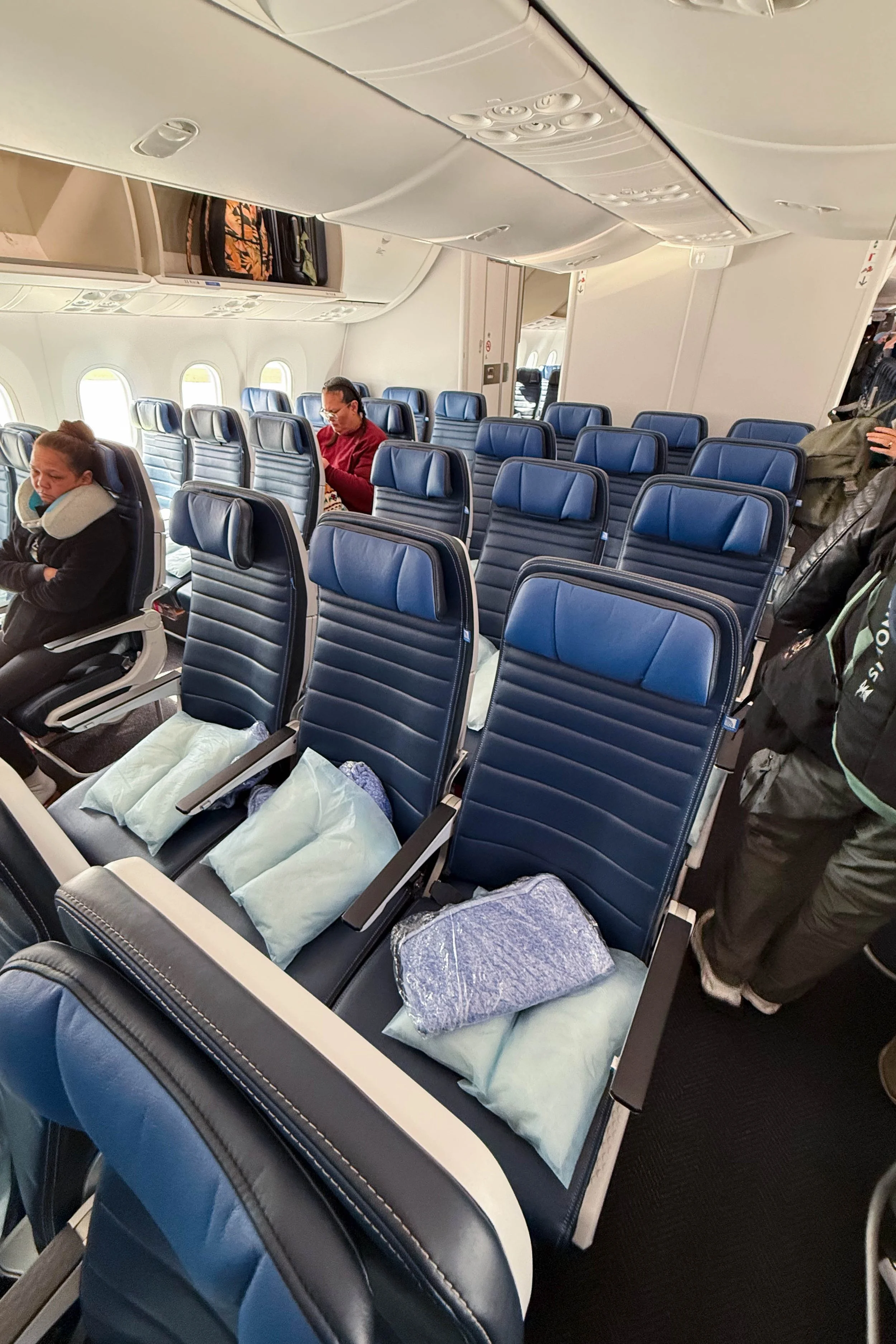 Blanket and pillow provided at each seat