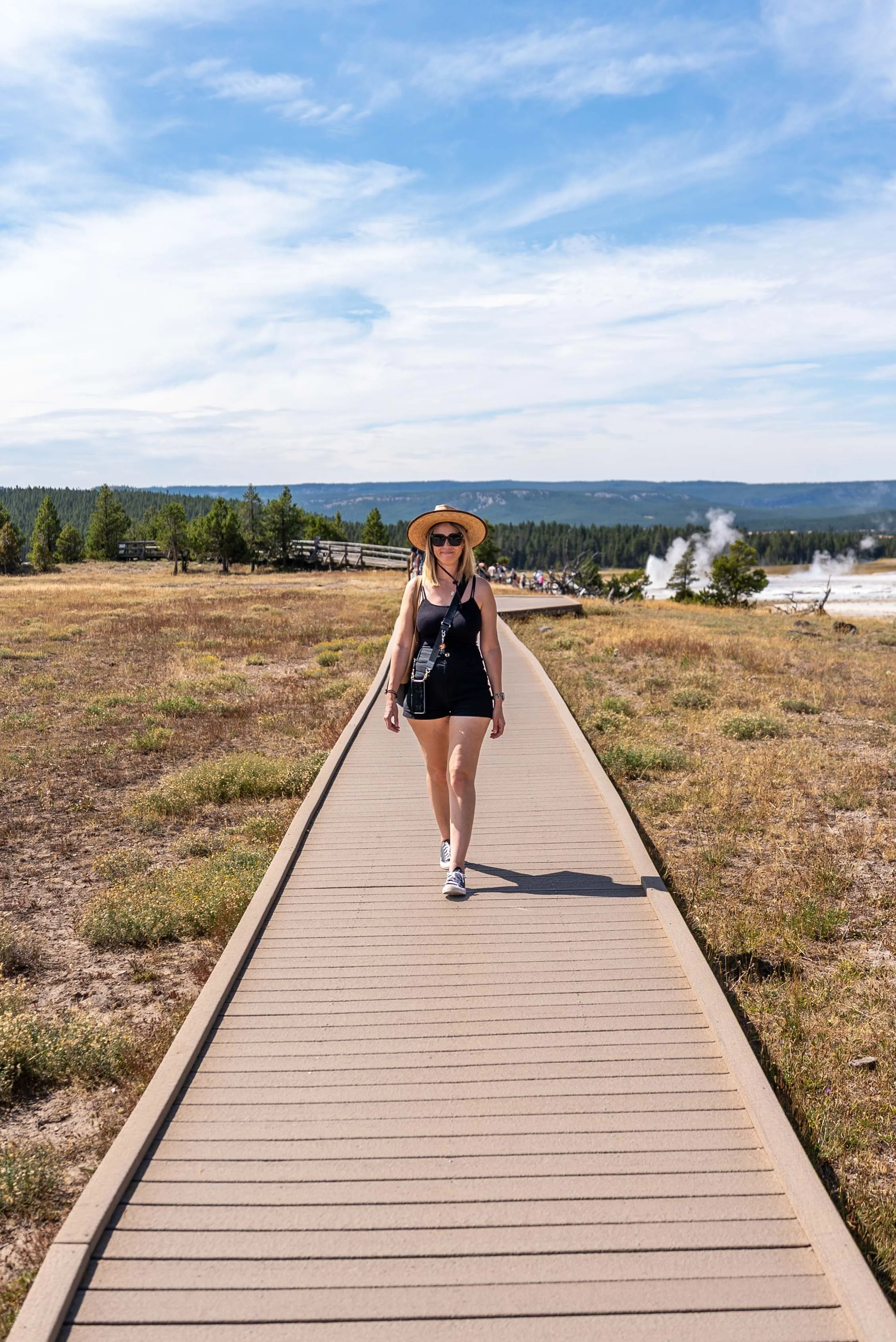 Walking on the boardwalk at Fountain Paint Pot Yellowstone