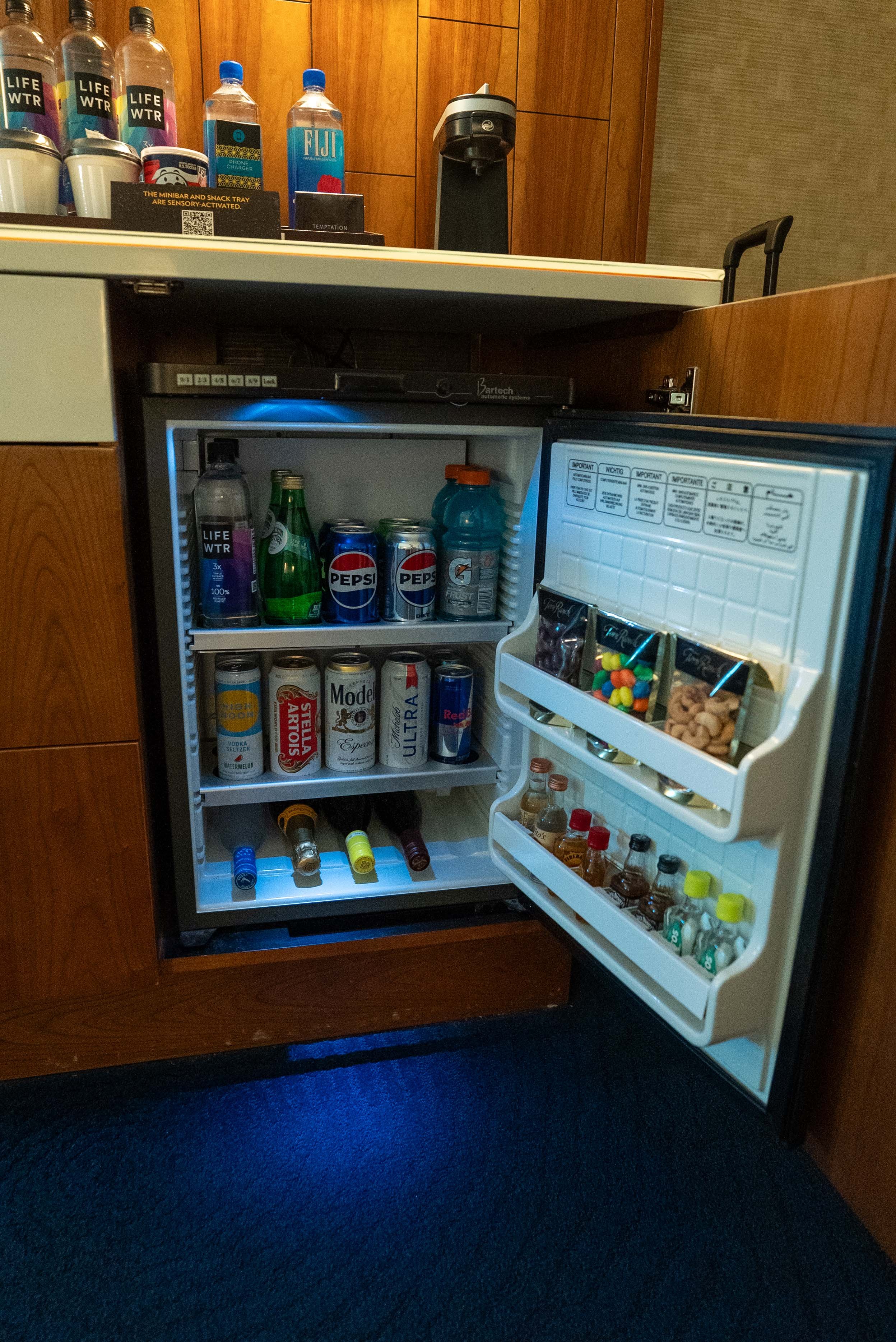 Mini fridge filled with goods for purchase