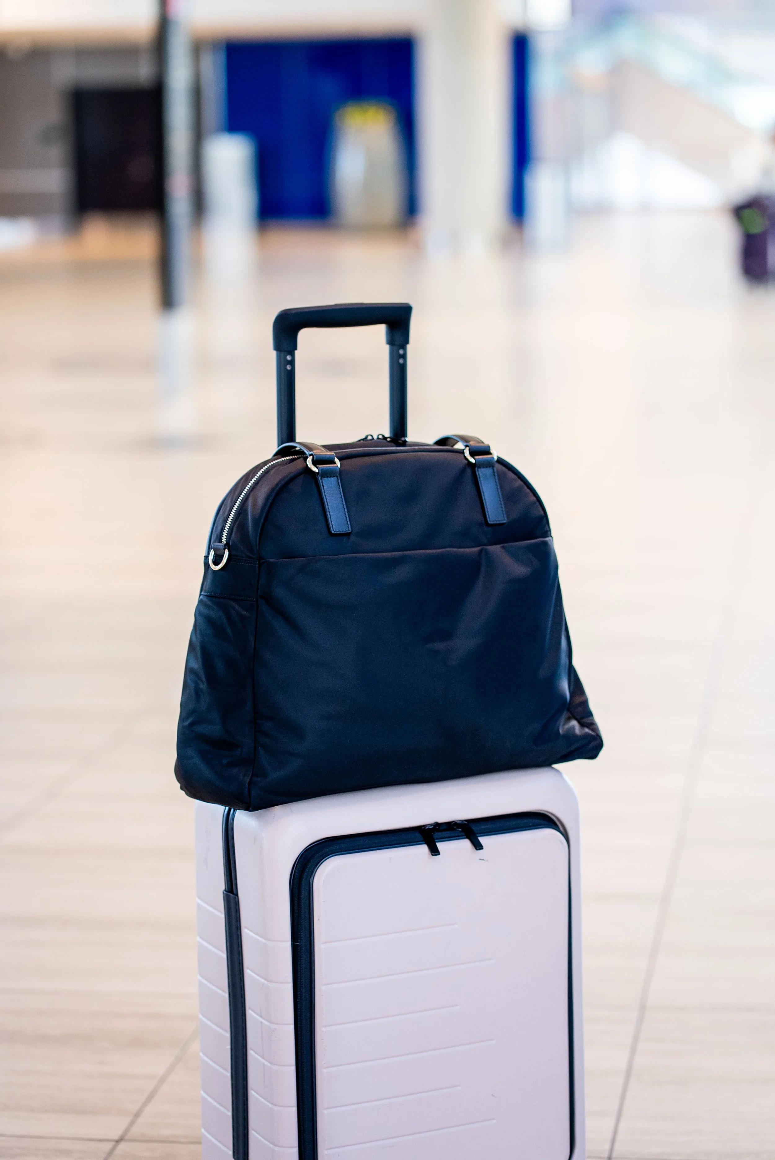 O.G. 2 tote on top of Quince Carry-On Suitcase