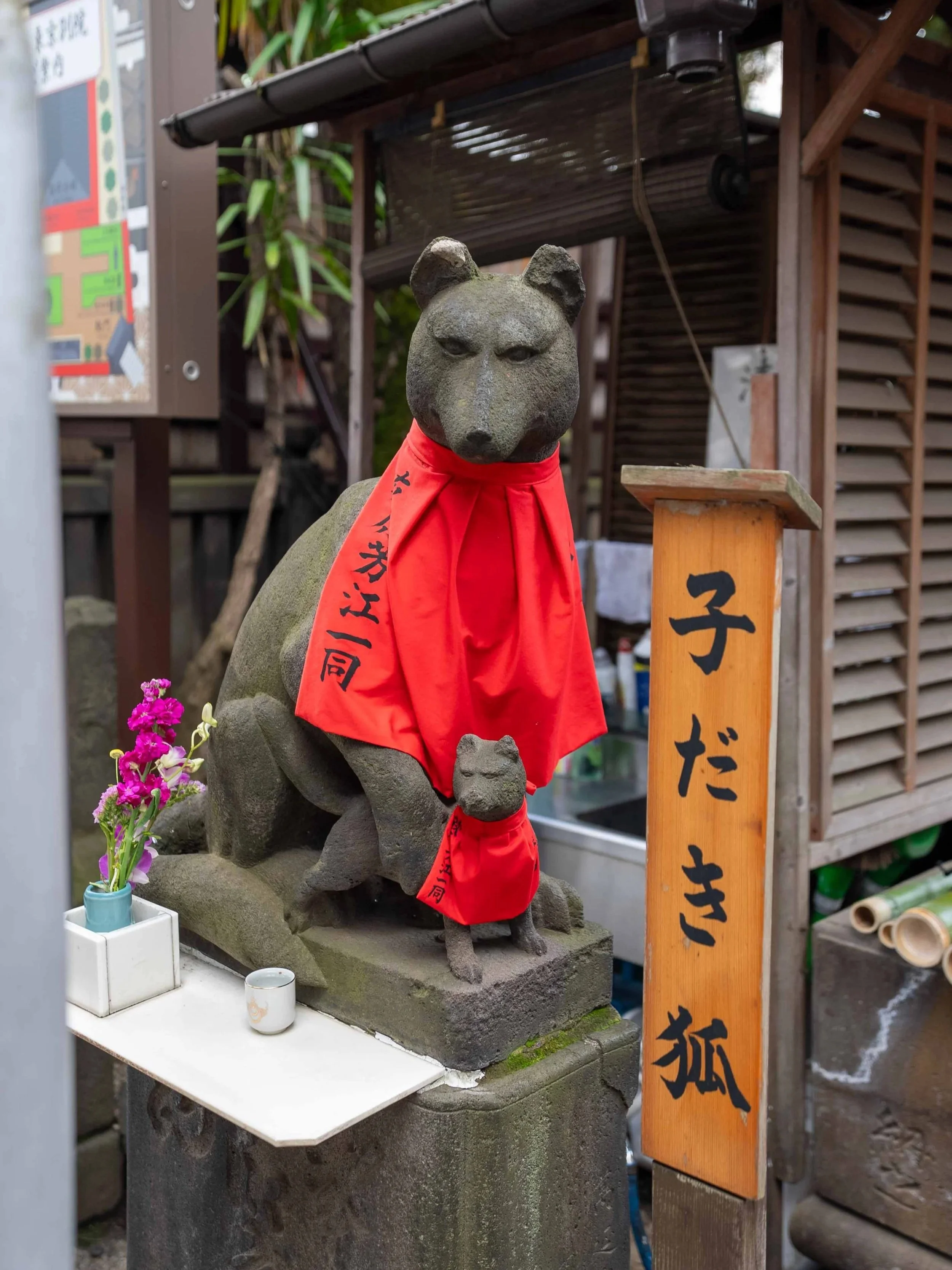 Fox statue holding a child