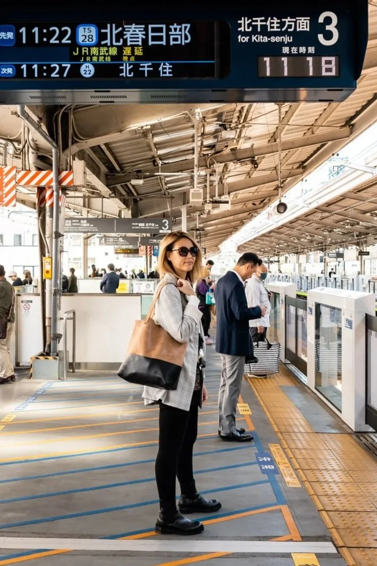 carrying a large tote bag