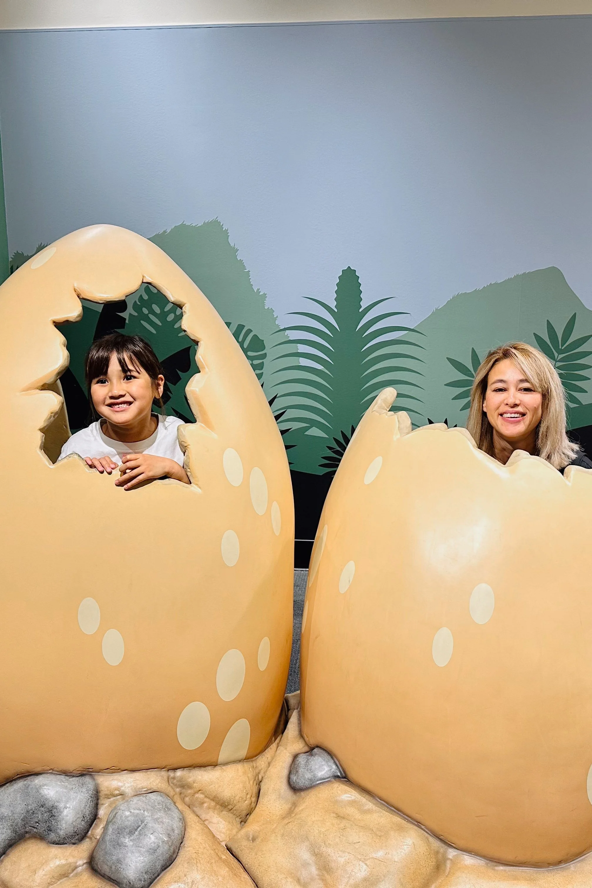 Photo op popping our heads out of dinosaur eggs