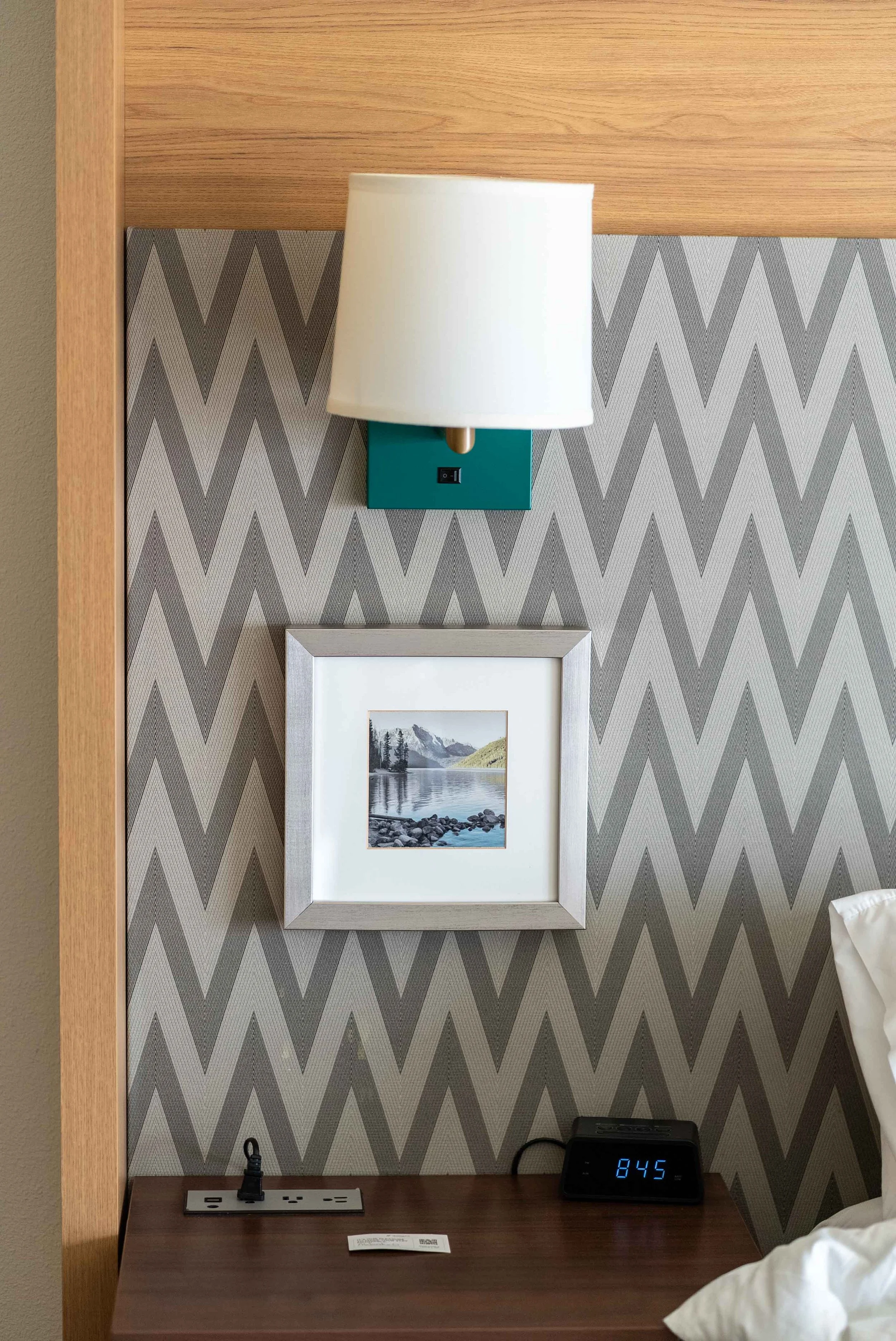 Outlets and USB ports on each side of the bed