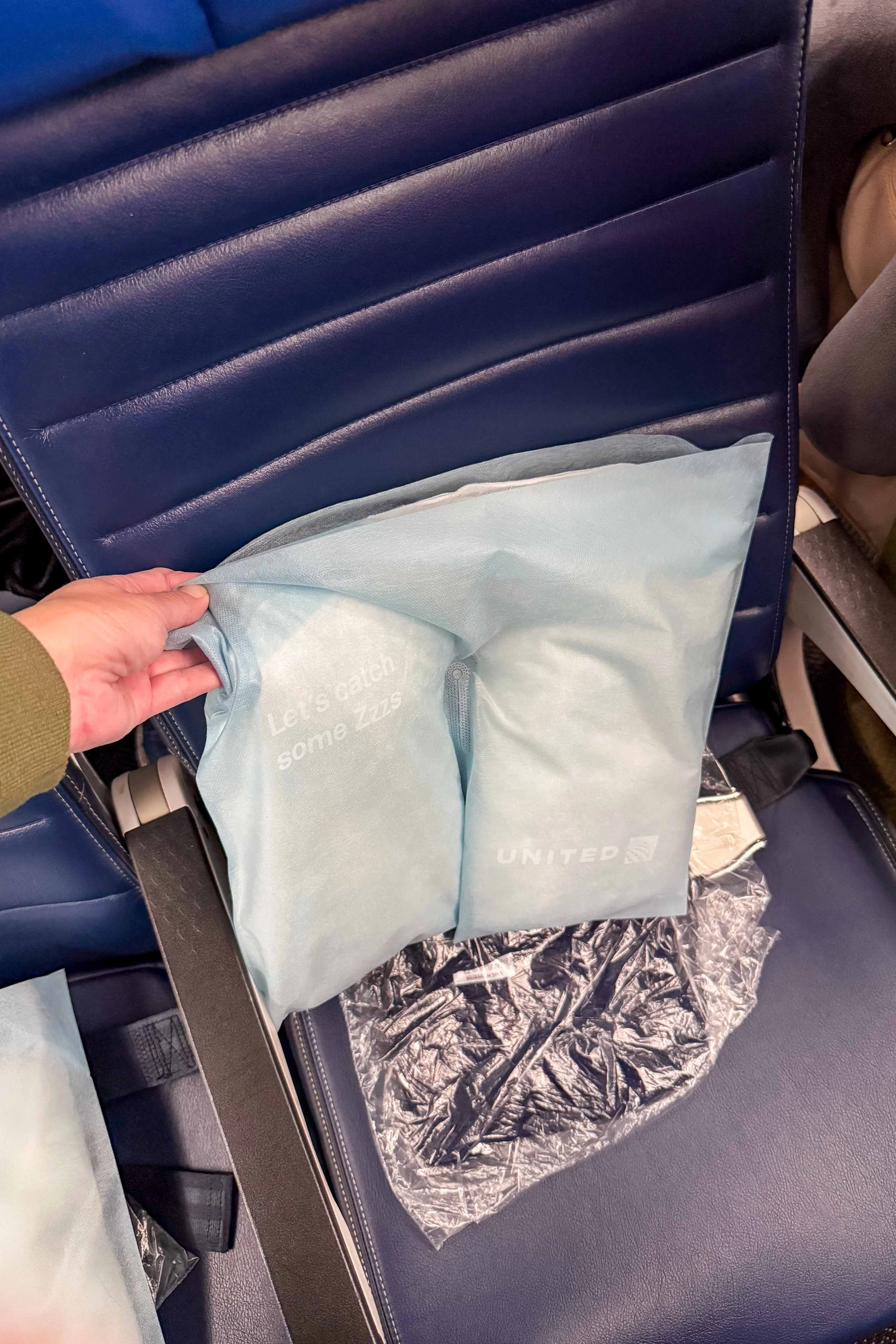 Pillow and blanket provided at each seat