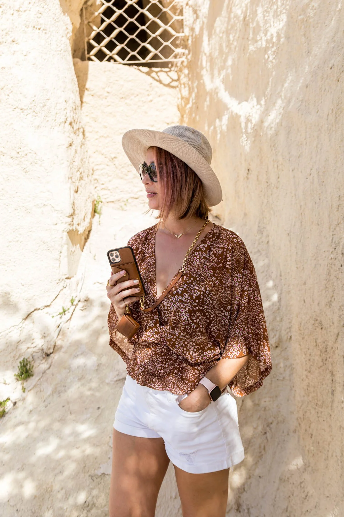 holding a bandolier phone case