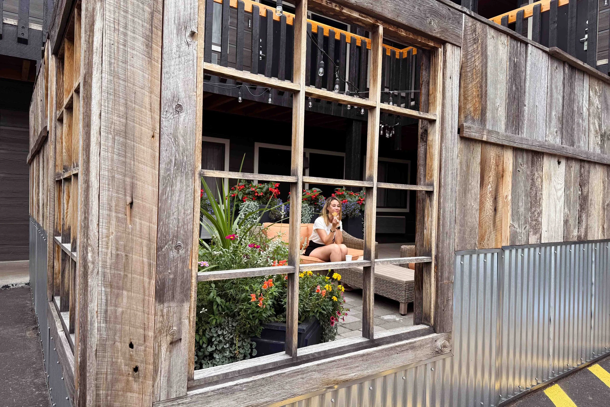 Eating my delicious free cookie in the cute outdoor lounge in front of our hotel room