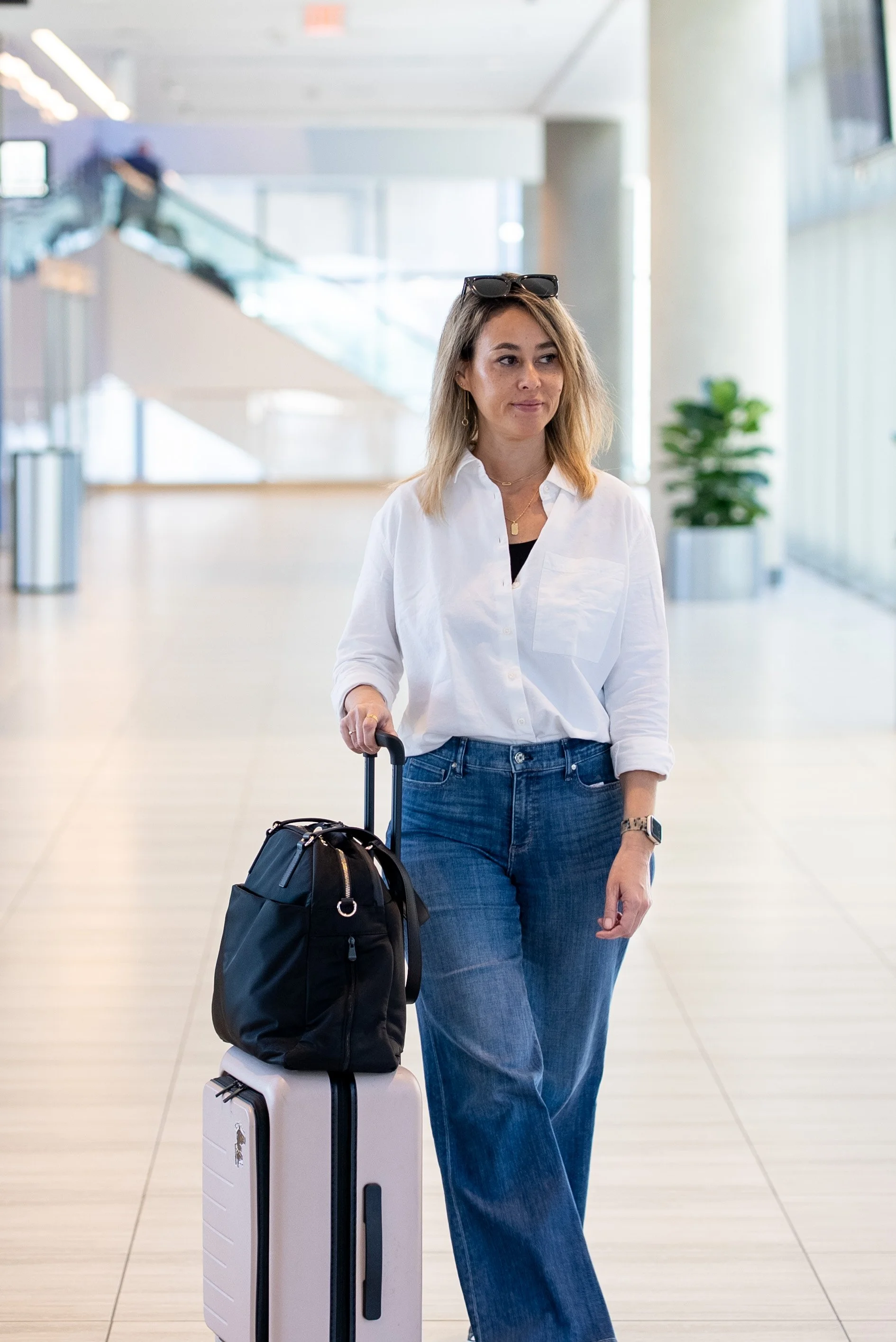 Walking through the airport with the O.G. 2 on top of suitcase