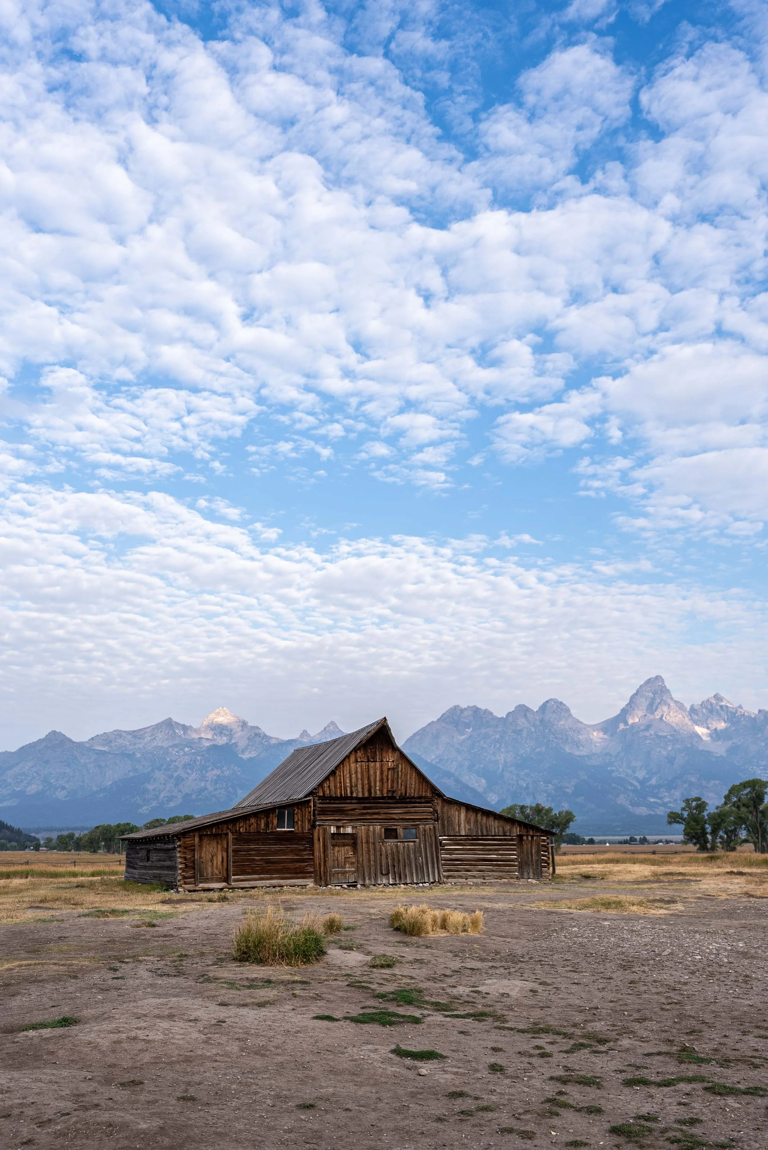 Mormon Row barn house with Grand Teton mountains in the background