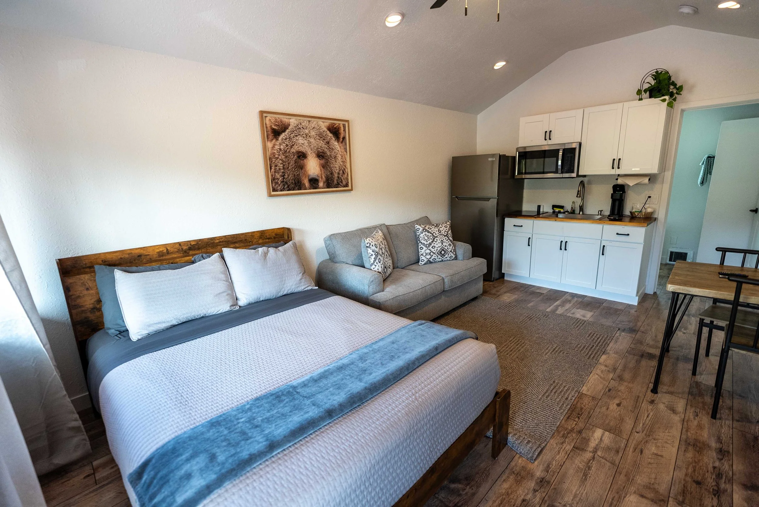 Cozy room with queen bed and sofa