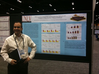 Dr. Kinney smiles in front of his first SfN poster as Principle Investigator.