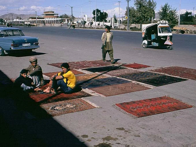 A Typical Day in the Rug Business Rugs fading in the Afghan sun.