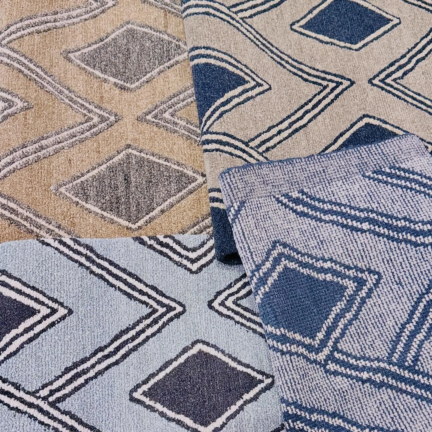 Kuba in Blue, Ebony, Sand, and Desert. This pattern is available in samples at our showroom.