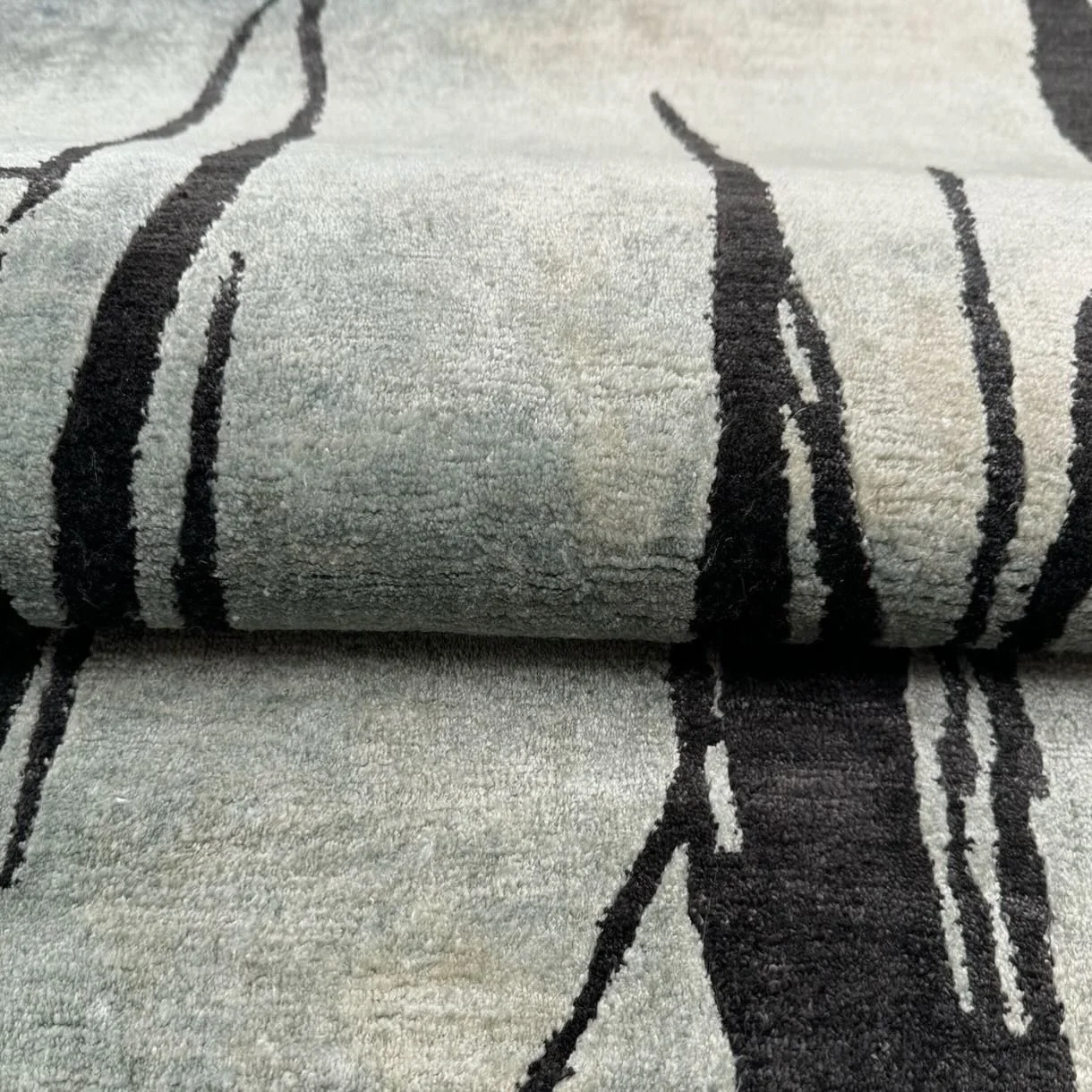 Waterdance is an exquisite art piece! The water reflection scene is crafted to be an absolutely stunning abstract. @woolandsilkrugs  sample available at our showroom.