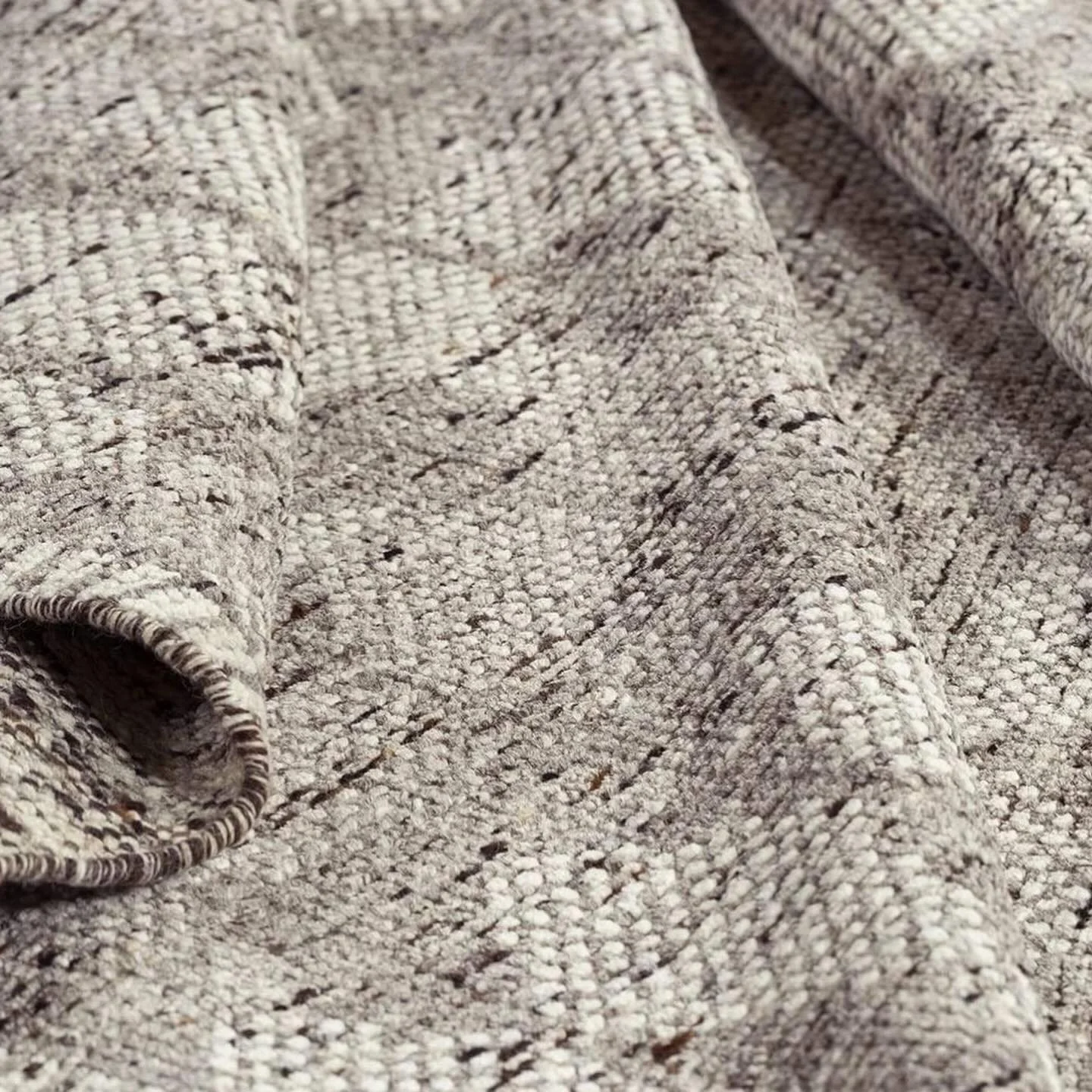 Add warmth to your living room with this hand knotted wool rug, boasting neutral patterns, grey diamonds, and stripes. Check out a sample at our Seattle showroom. @tufenkiancarpets