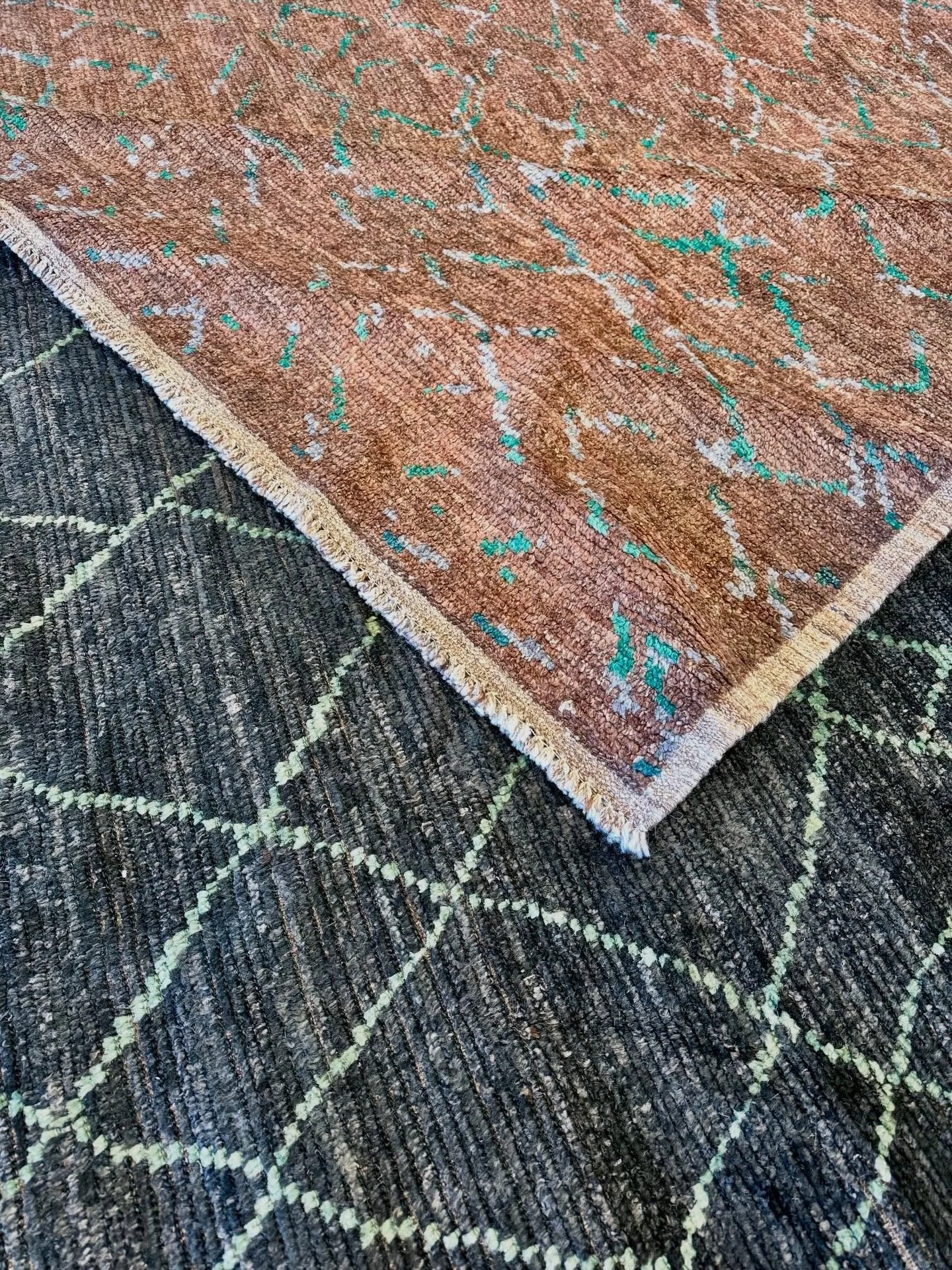 Mosaic and Cobblestone are Afghanistan-made geometric designer rugs that bring warmth to your home.