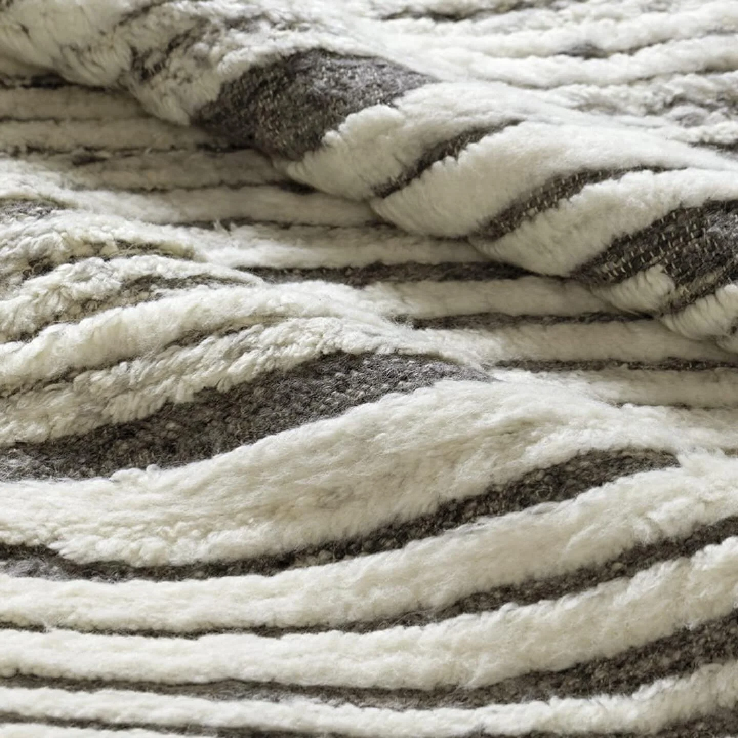 Get the sample for this rug! Wrap your space in comfort with Bevel Grey Heather's soft, striped wool blend, designed to make your home feel stylish and serene. @tufenkiancarpets