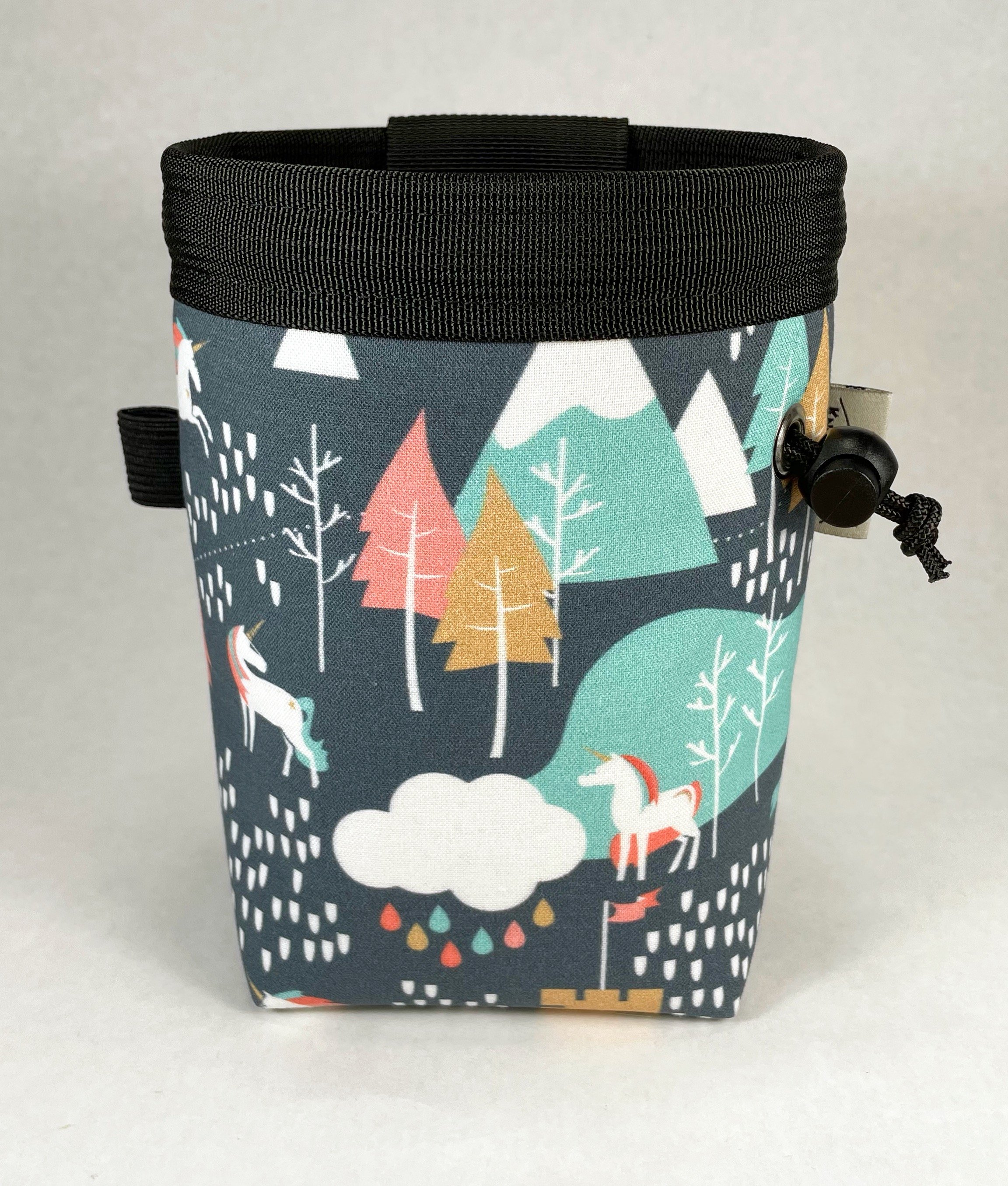 light pink and blue unicorns, castles, mountains, and trees on gray / rock climbing chalk bag