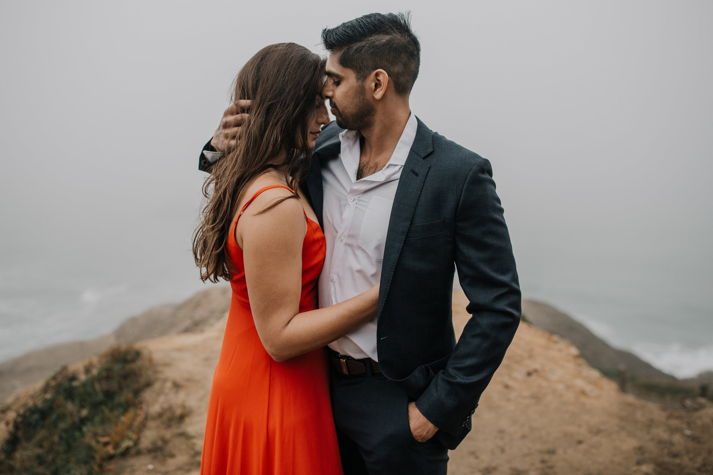 bre thurston photography | san francisco bay area wedding engagement photographer | engaged couple photo session in city, foggy forest, stormy beach, red dress