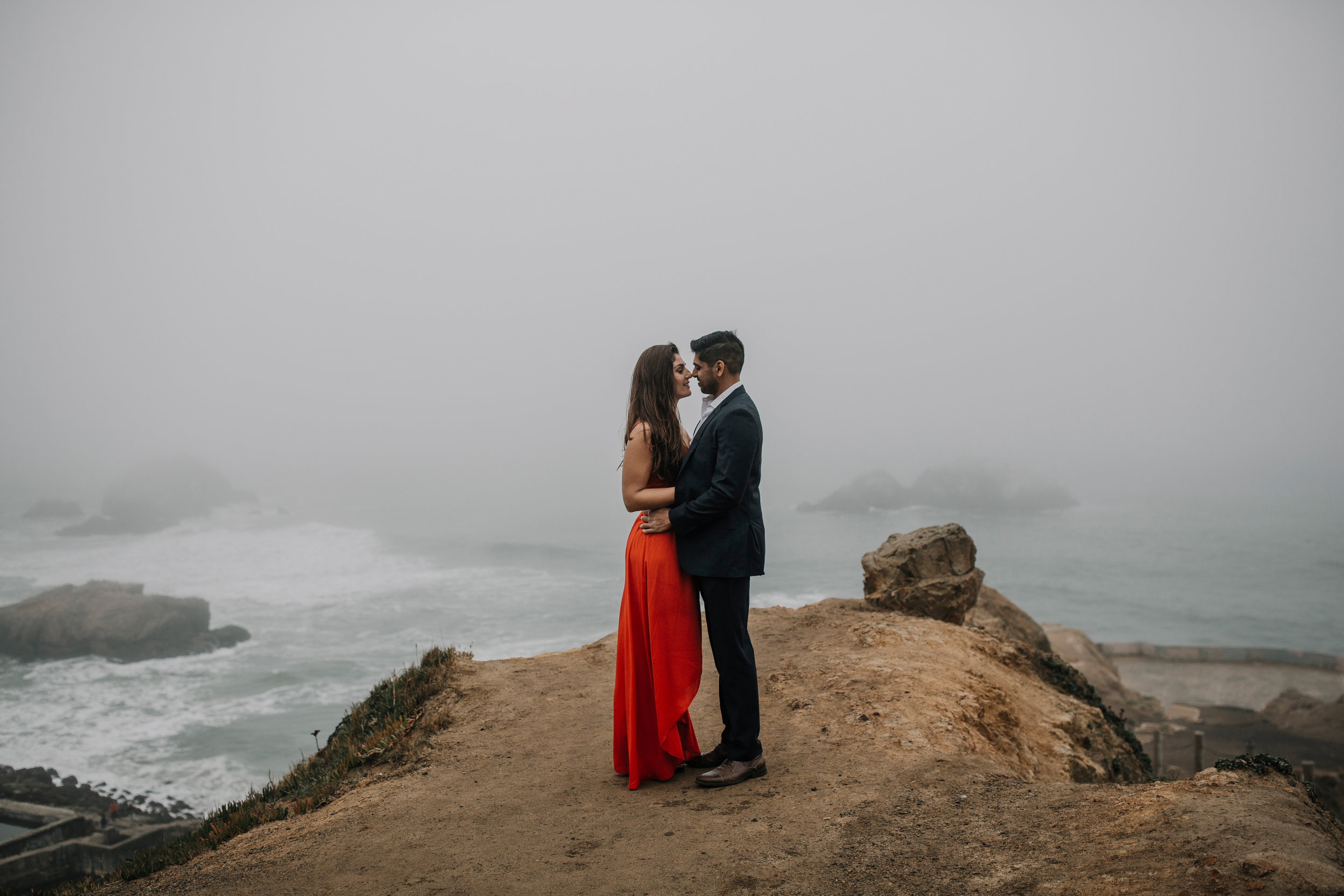 bre thurston photography | san francisco bay area wedding engagement photographer | engaged couple photo session in city, foggy forest, stormy beach, red dress