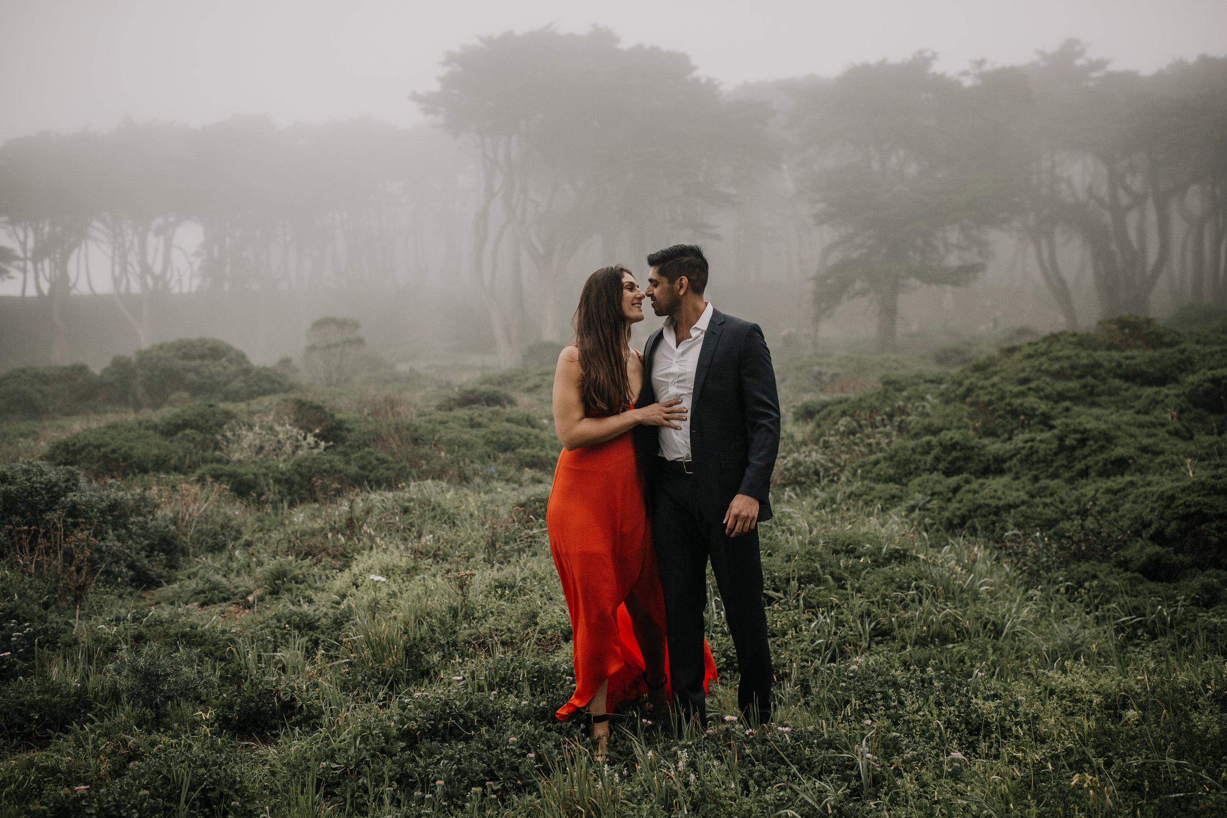 bre thurston photography | san francisco bay area wedding engagement photographer | engaged couple photo session in city, foggy forest, stormy beach, red dress
