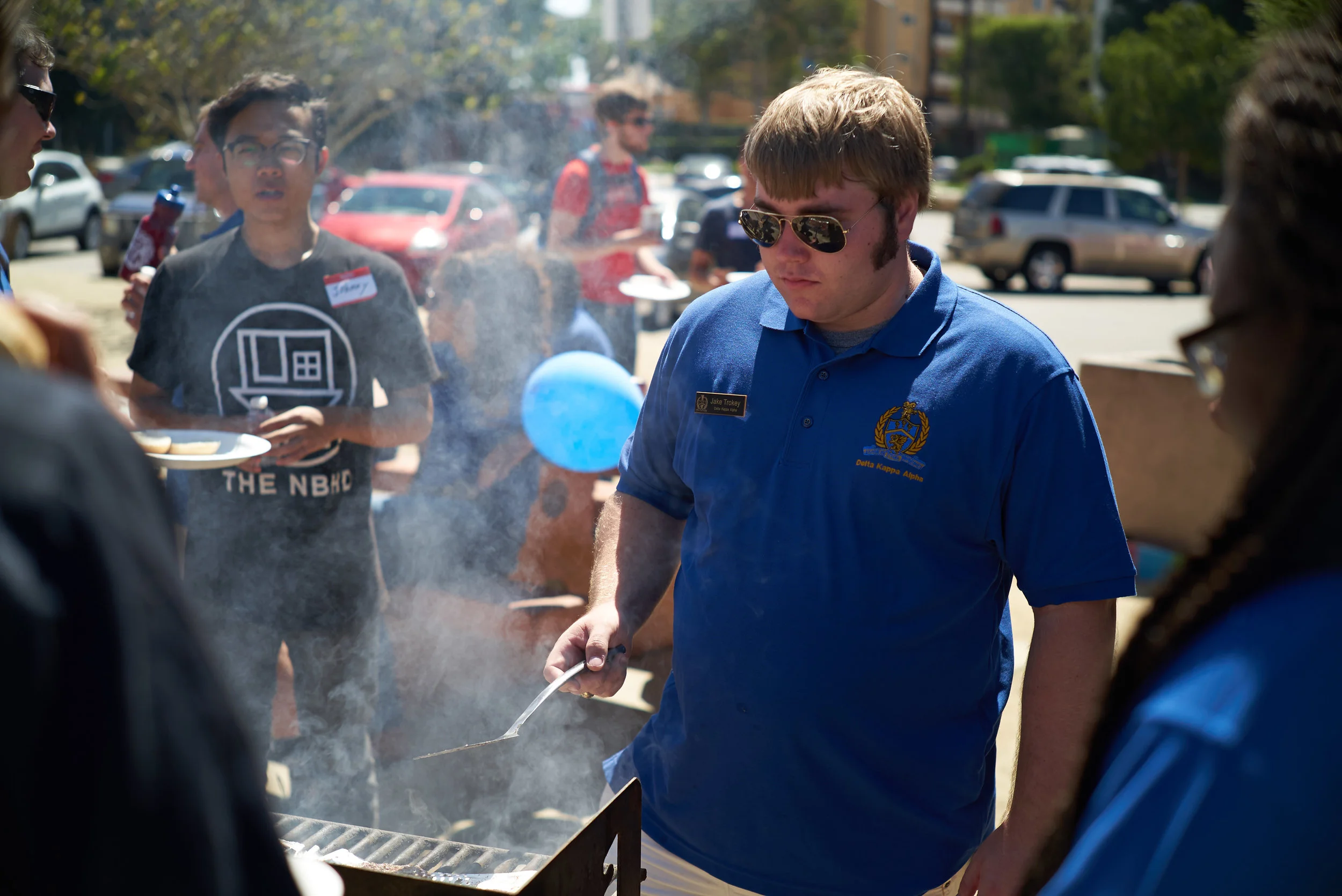 Jake Trokey grills hamburgers